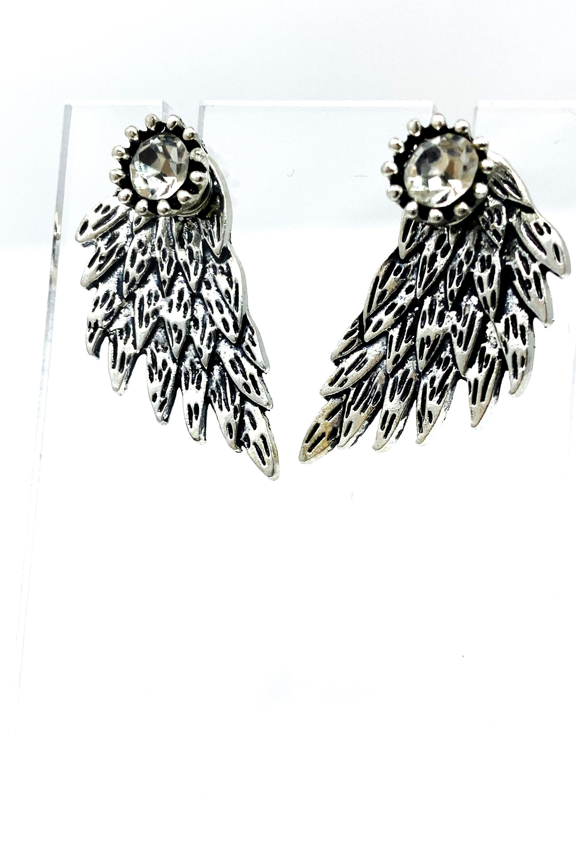 A pair of 420 Wingz Earrings featuring a unique wing design with a diamond accent, available in gold, silver, and black colors.