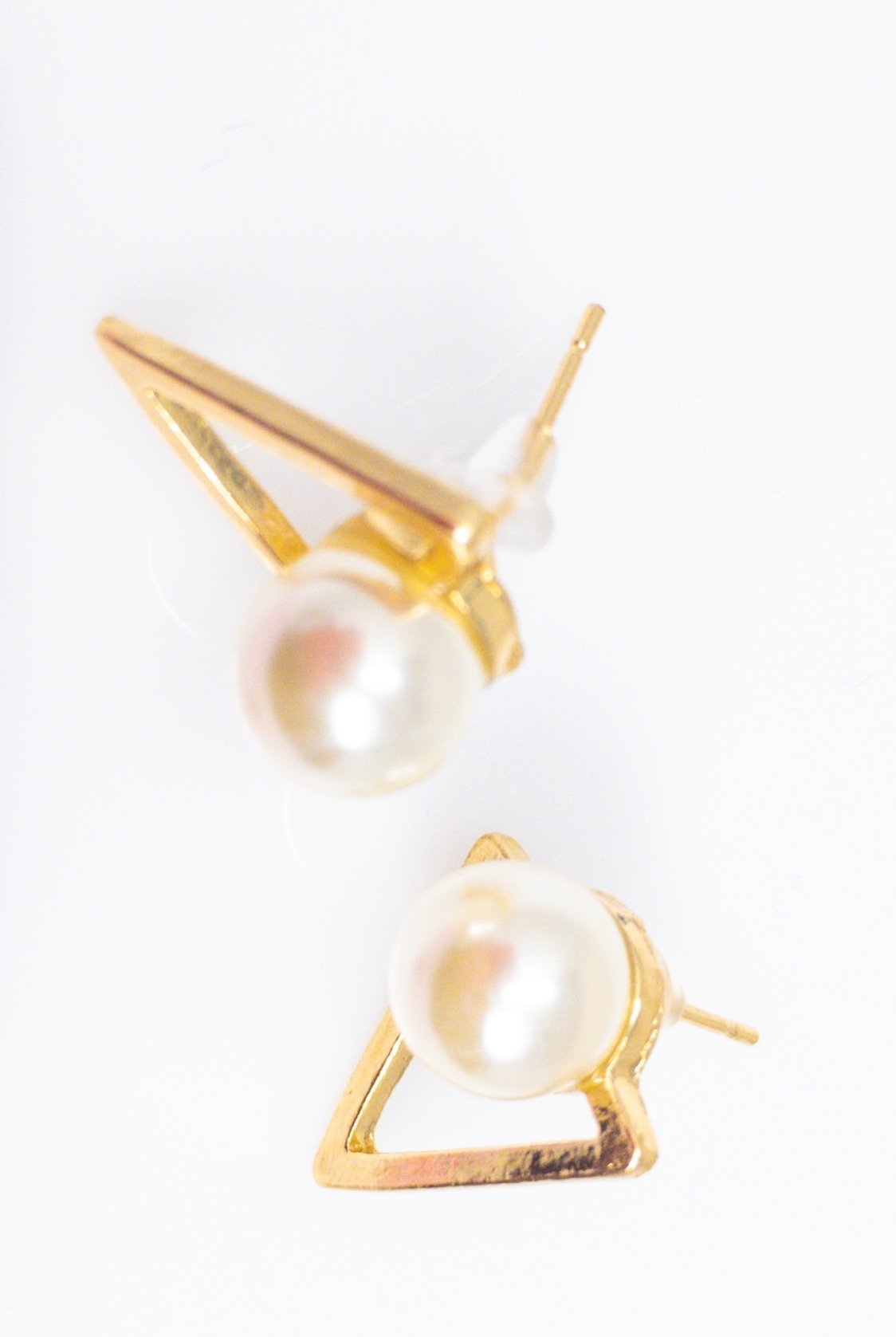 Aisha's classy stud earrings featuring a geometric design in gold with simulated pearls, perfect for any occasion.