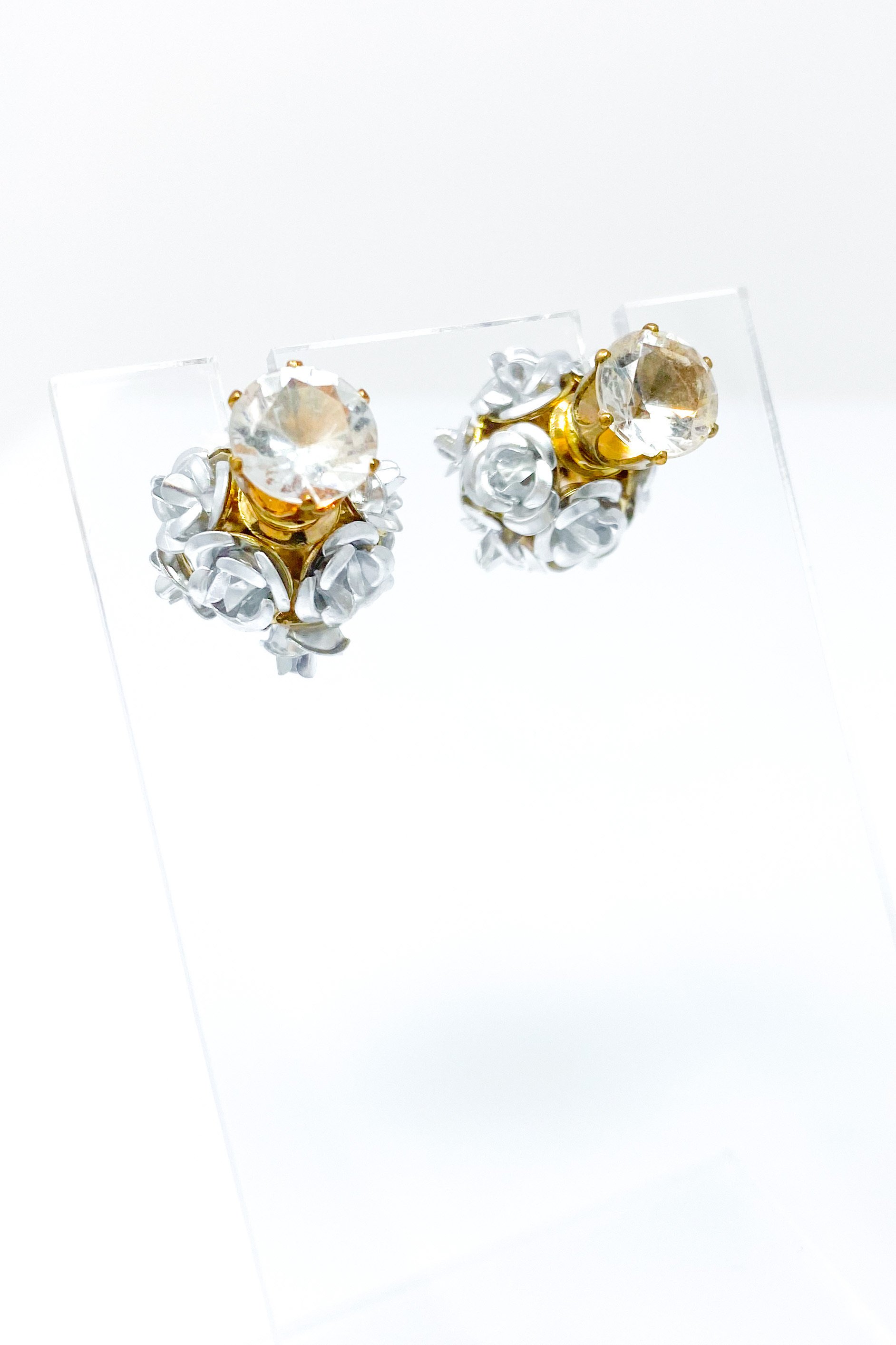 Elegant Flower Blossoms Studs featuring a diamond stud and a floral back design, available in gold and multi-colored options.