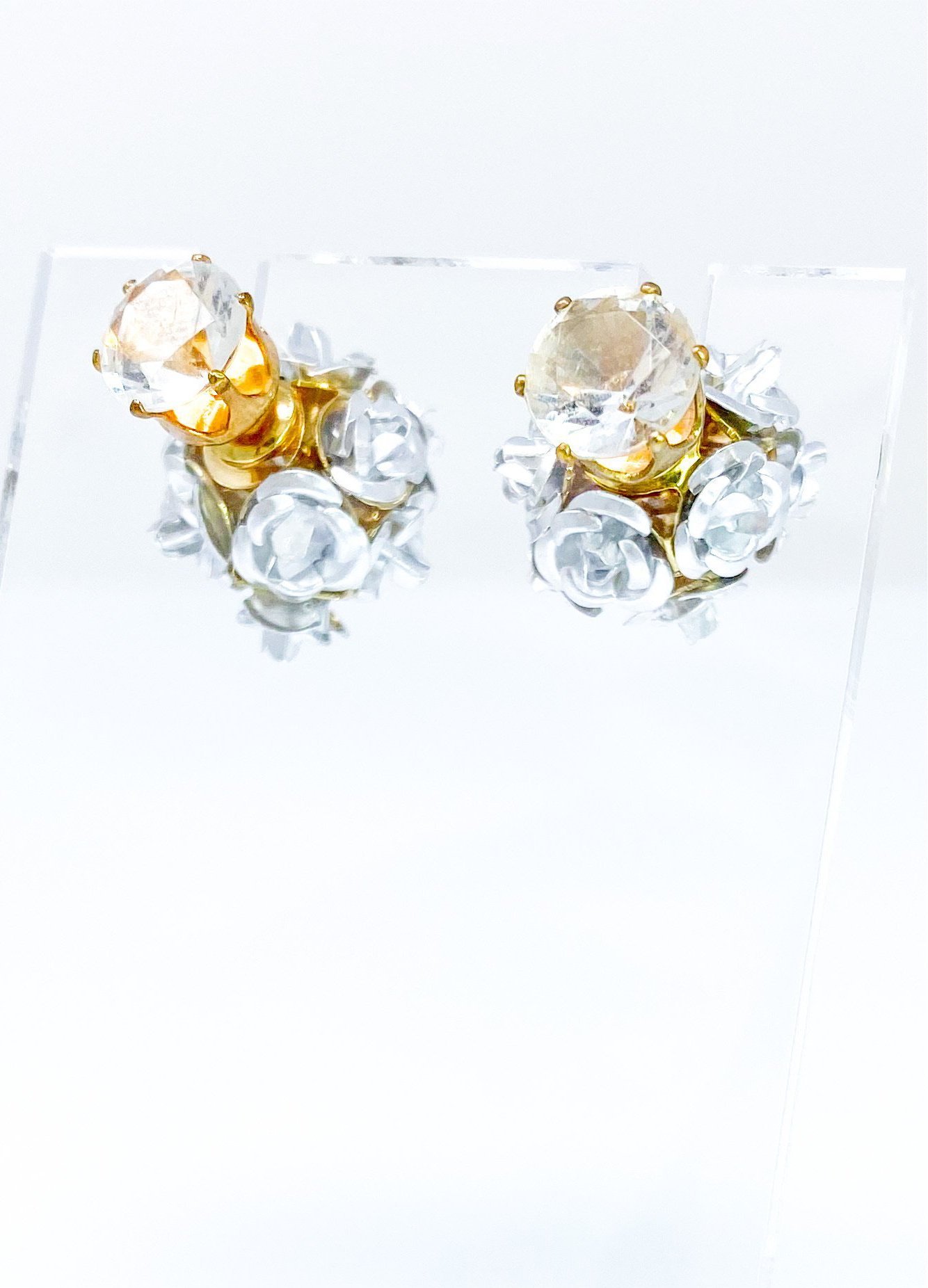 Elegant Flower Blossoms Studs featuring a diamond stud and a floral back design, available in gold and multi-colored options.