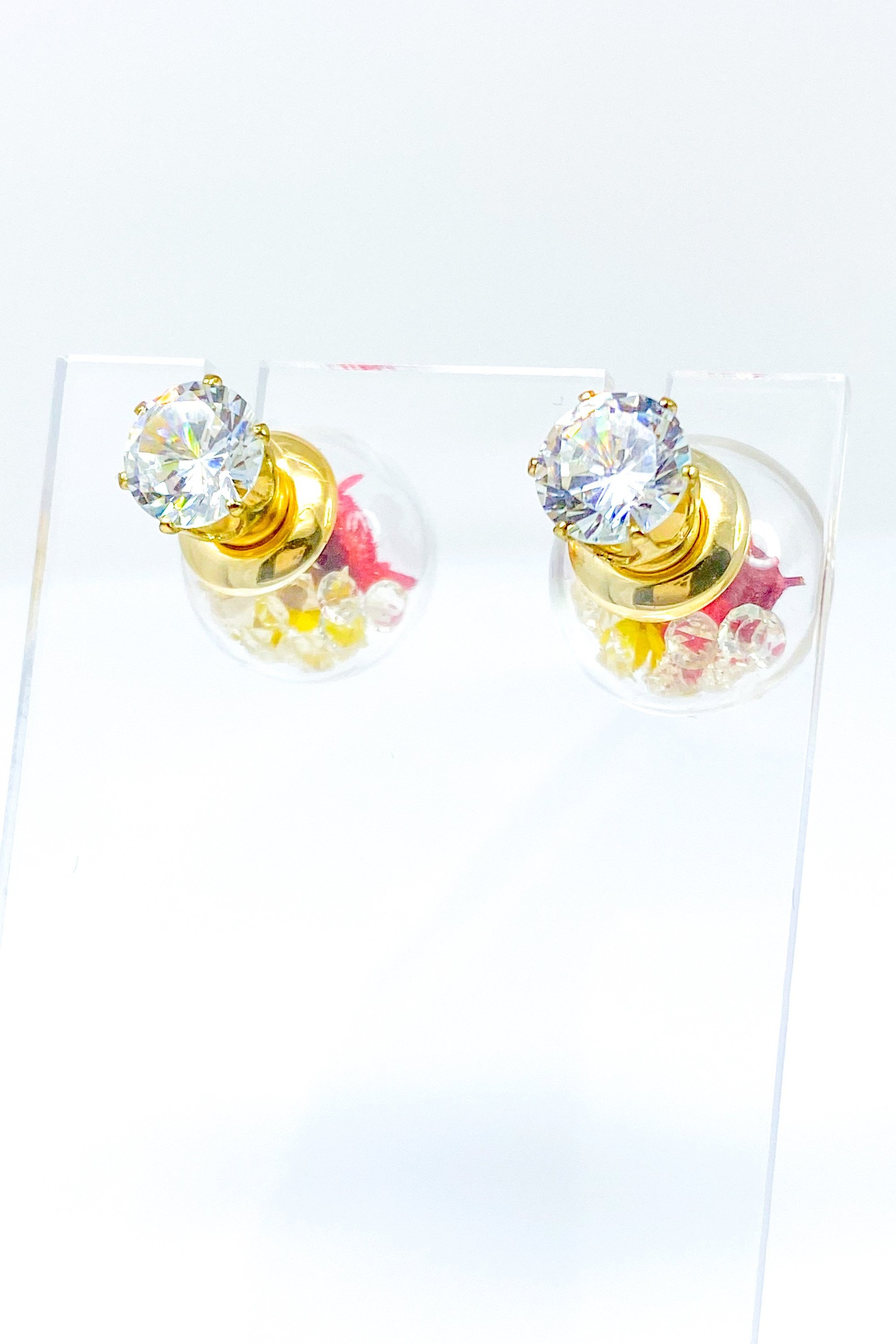 Perennial Ice Studs featuring handcrafted moving flowers and a plastique ice ball design in gold and multicolored options.