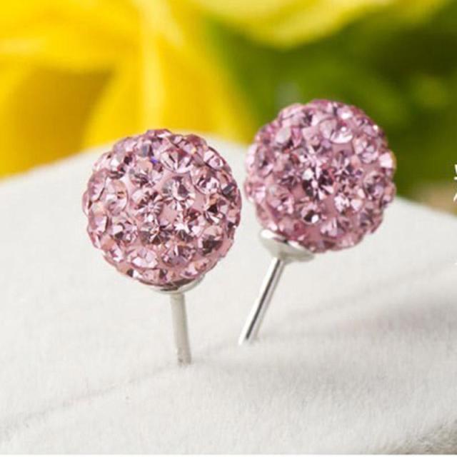 A pair of multicolored glitter studs made from high-quality zinc alloy, featuring a geometric design perfect for casual and stylish wear.