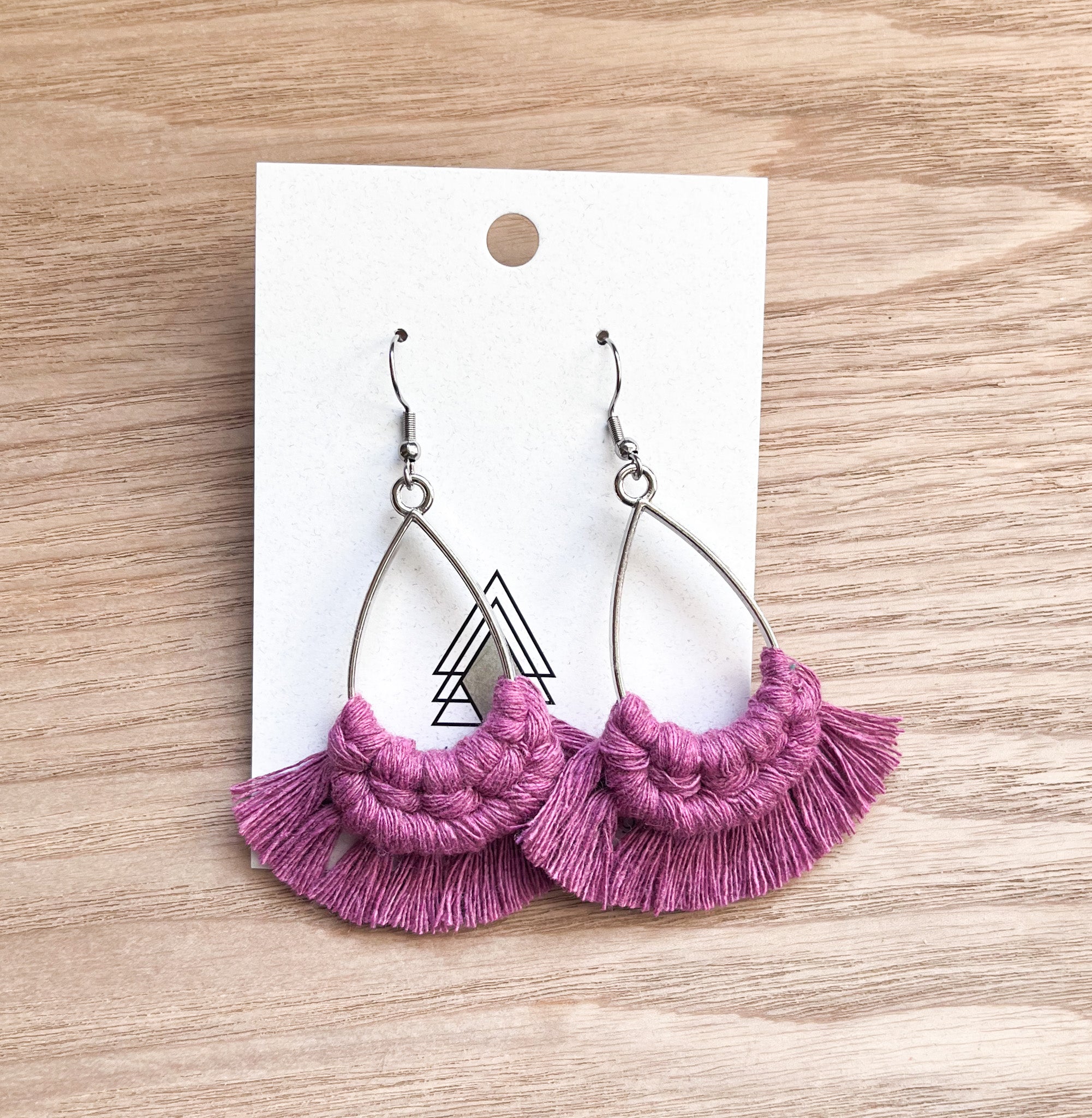 A pair of lightweight Summer Fuchsia Teardrop earrings made from 100% cotton cord, showcasing a vibrant pink color.