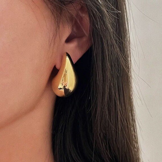 Elegant TearDrop Glam Earrings featuring 18k gold plating, showcasing a stylish teardrop design.