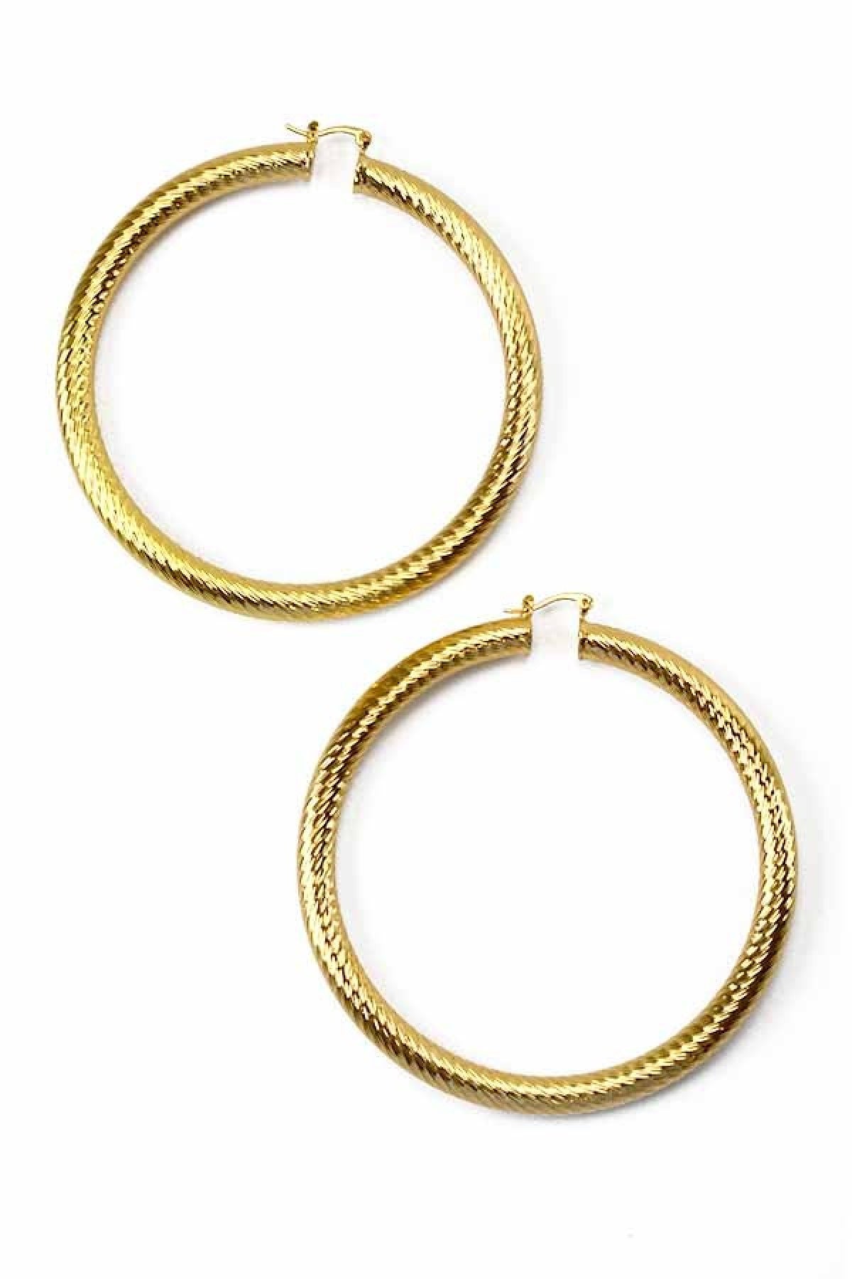 A pair of stylish textured hoop earrings with a latch back closure, measuring 3.5 inches in diameter, showcasing a unique design.