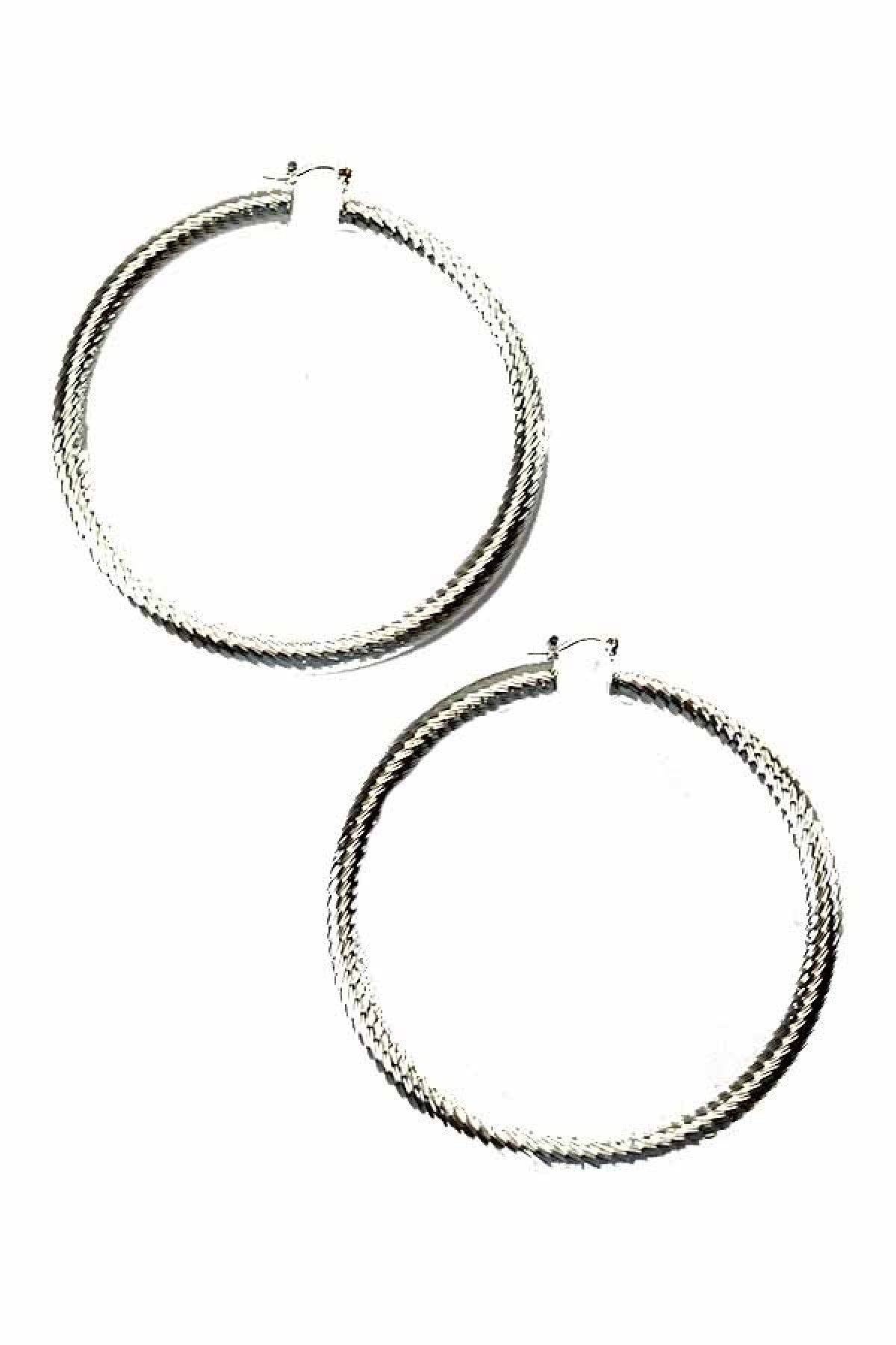 A pair of stylish textured hoop earrings with a latch back closure, measuring 3.5 inches in diameter, showcasing a unique design.