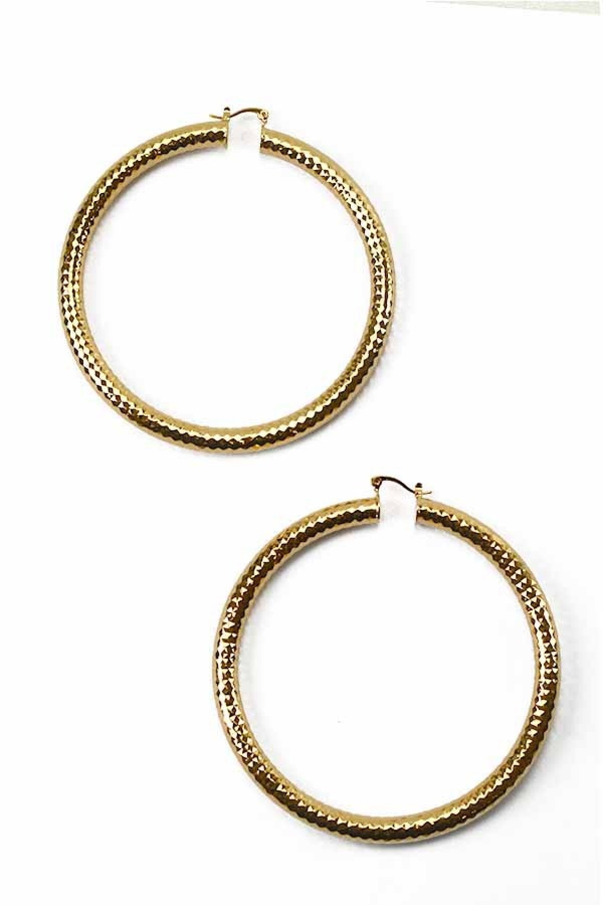 A pair of stylish textured hoop earrings with a latch back closure, measuring 3.5 inches in diameter, showcasing an elegant design.