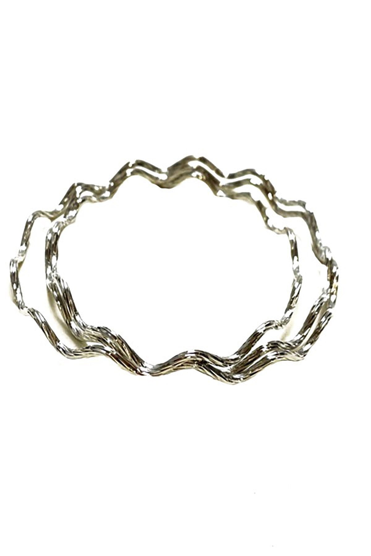 A stylish textured multi bangle bracelet with a chic design, showcasing its unique texture and approximate 2.75 inch diameter.