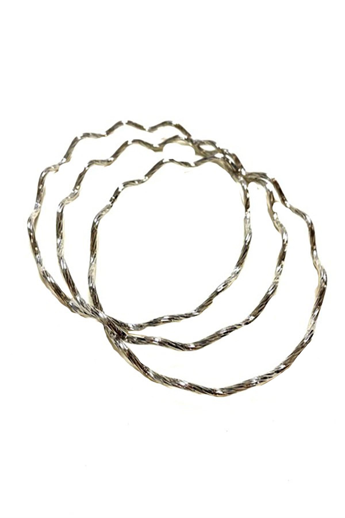 A stylish textured multi bangle bracelet with a chic design, showcasing its unique texture and approximate 2.75 inch diameter.