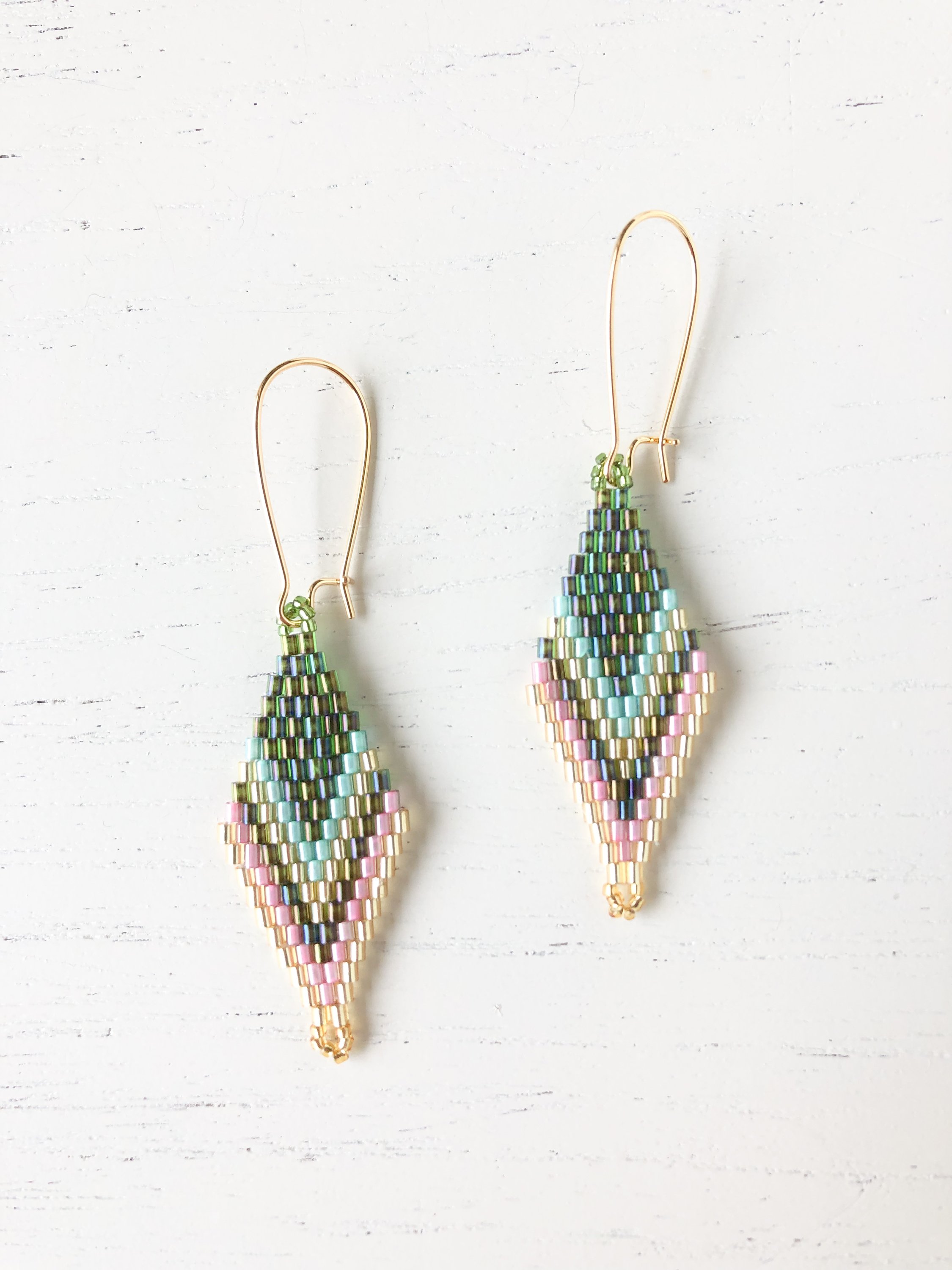 The Vera - Green/Pink Hook, a hand-beaded accessory made from nickel-free brass, showcasing vibrant colors and elegant design.