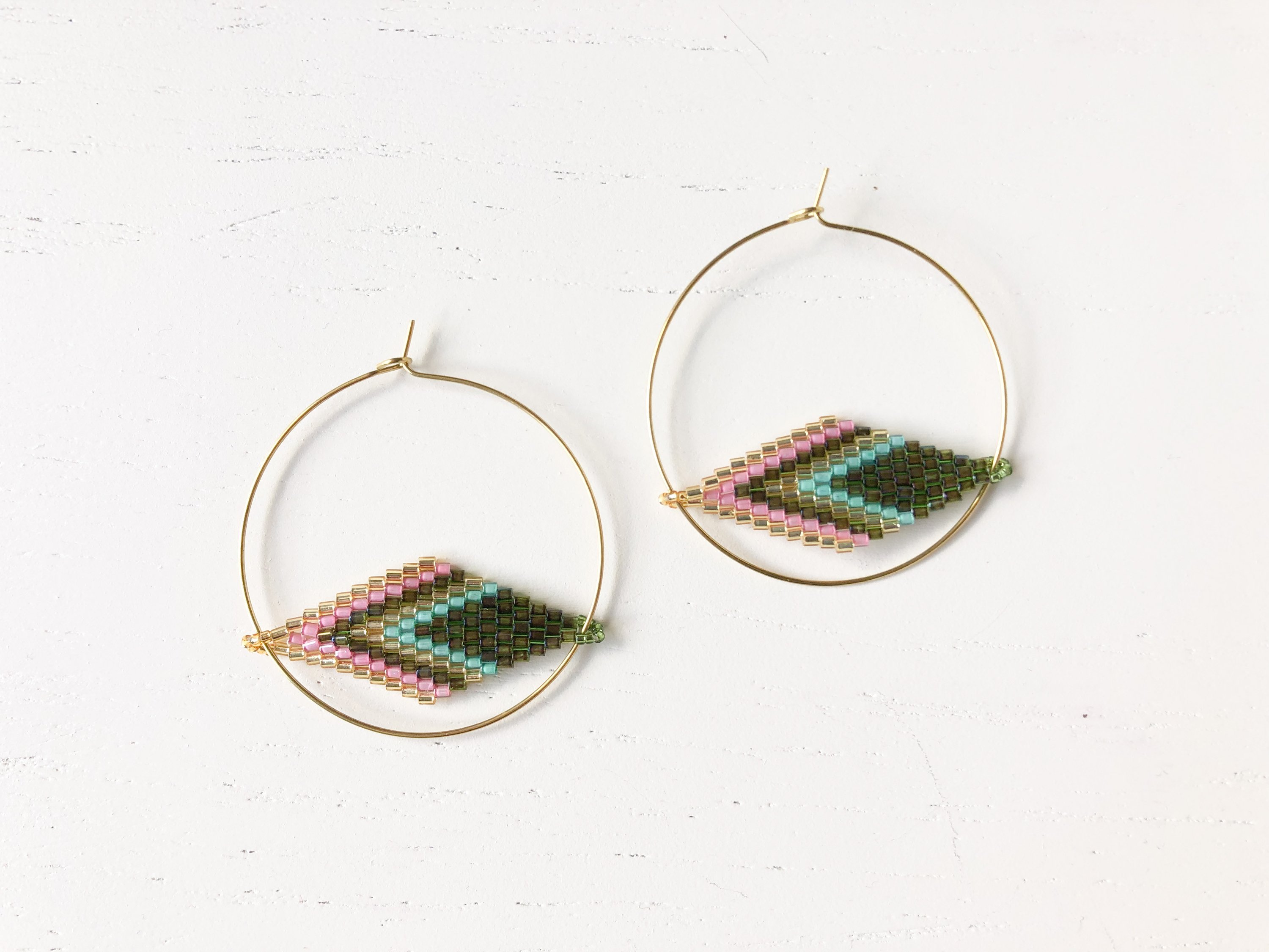 The Vera - Green/Pink Hoop earrings, hand beaded with vibrant colors, made from nickel-free brass.