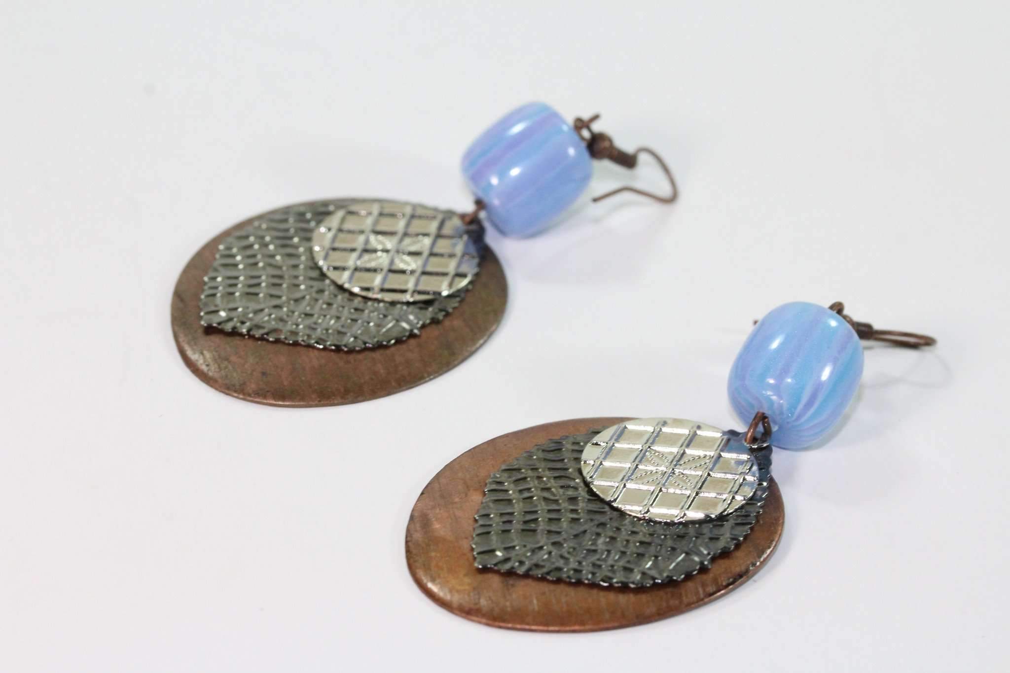 Three Disc & Stone Earrings featuring coppertone and silvertone with blue faux stones and an antique four-leaf design.