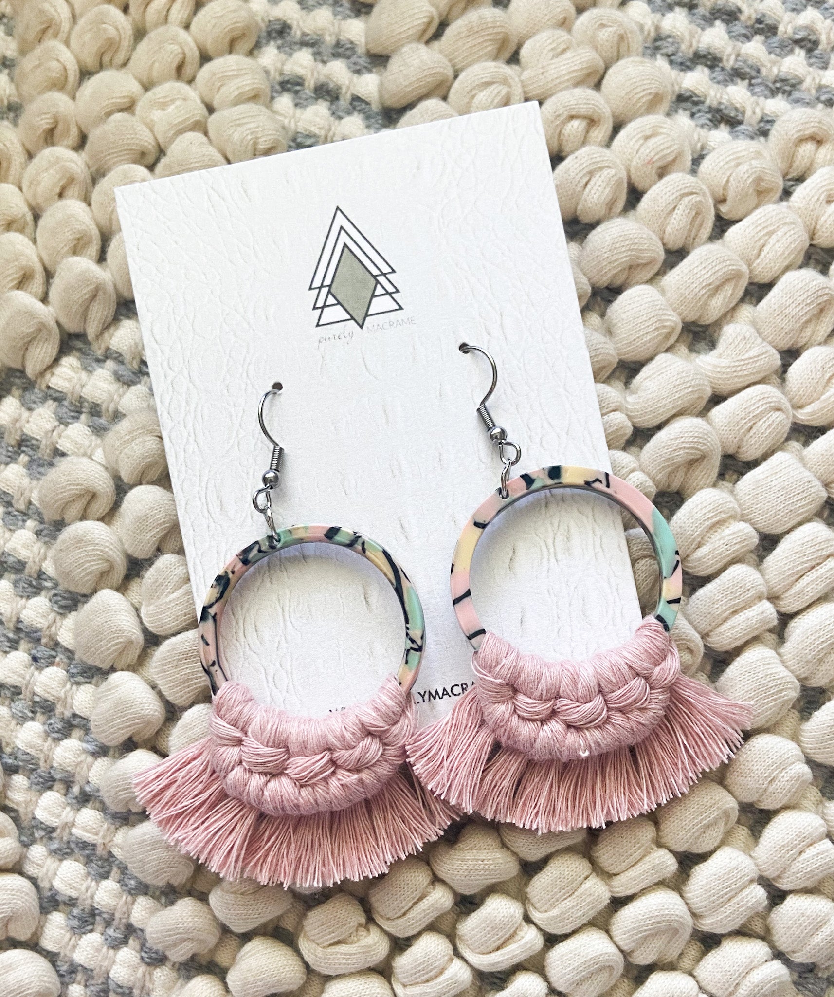 A pair of stylish tortoise earrings featuring a unique shell pattern, lightweight and hypoallergenic design.