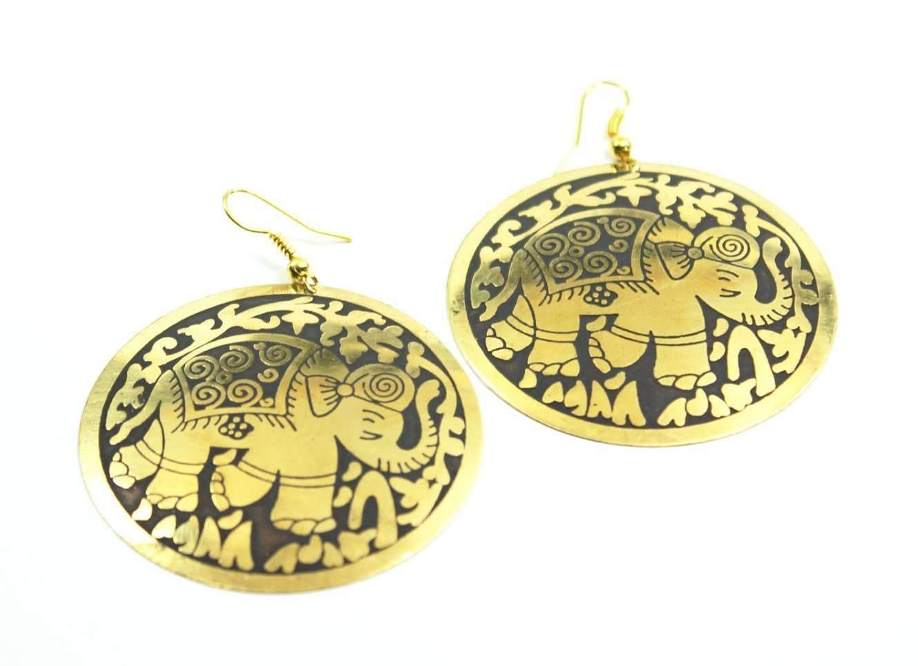 A pair of bold round earrings featuring embossed festival elephants, available in three vibrant colors, perfect for boho and casual outfits.