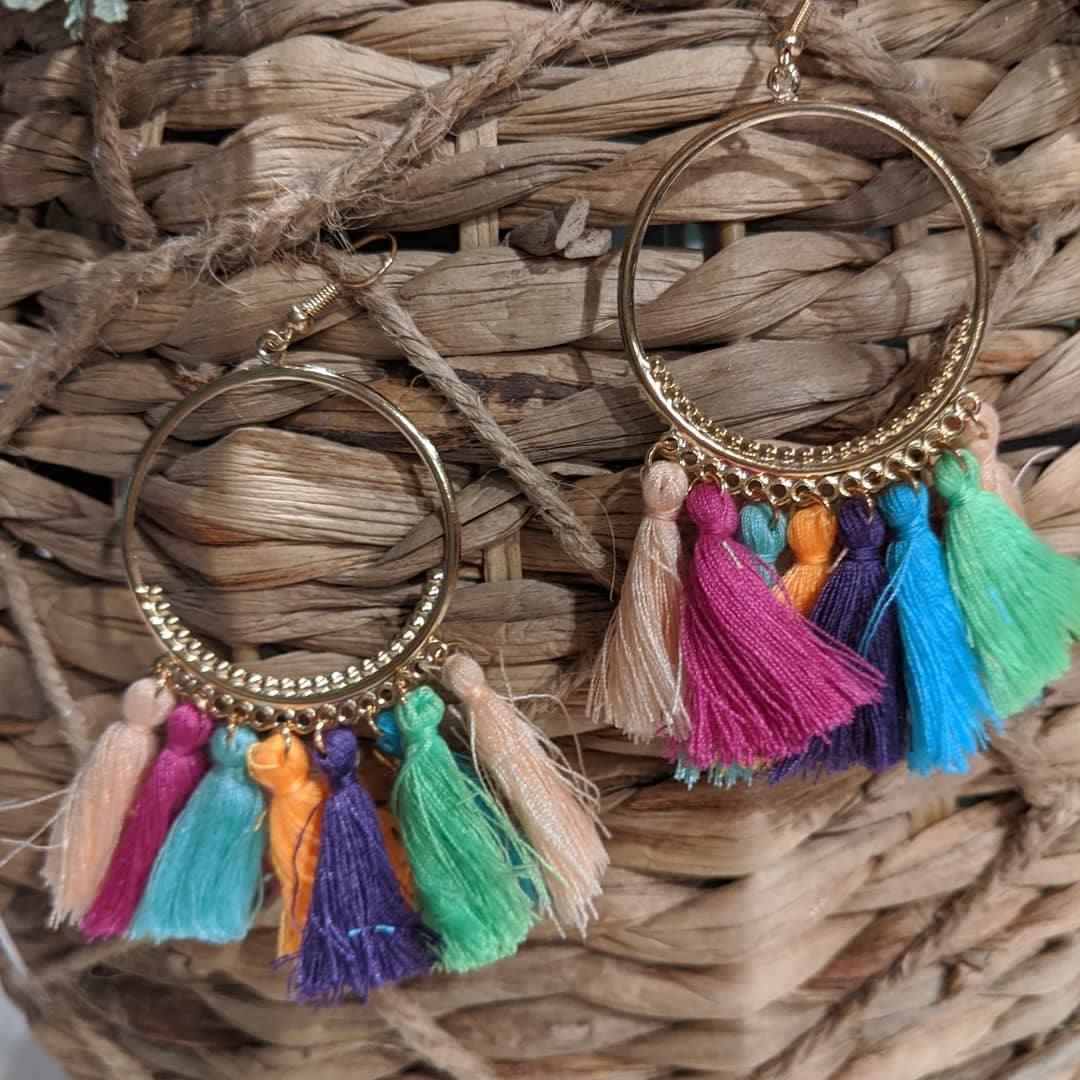 A pair of trendy tassel earrings featuring vibrant colors and a lightweight design, perfect for spring and summer outfits.