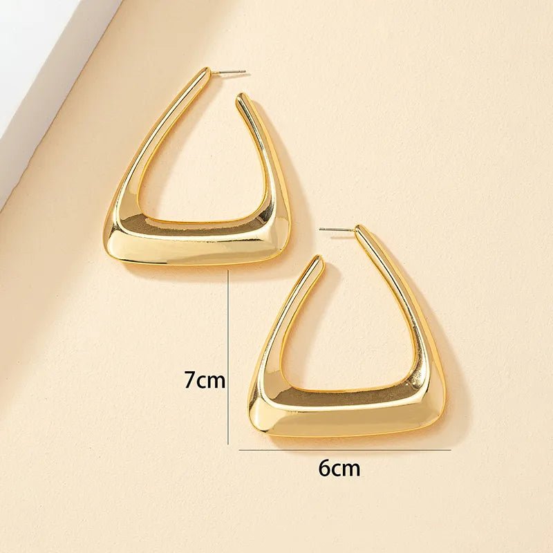 A pair of elegant triangular gold earrings showcasing a modern design, perfect for any occasion.