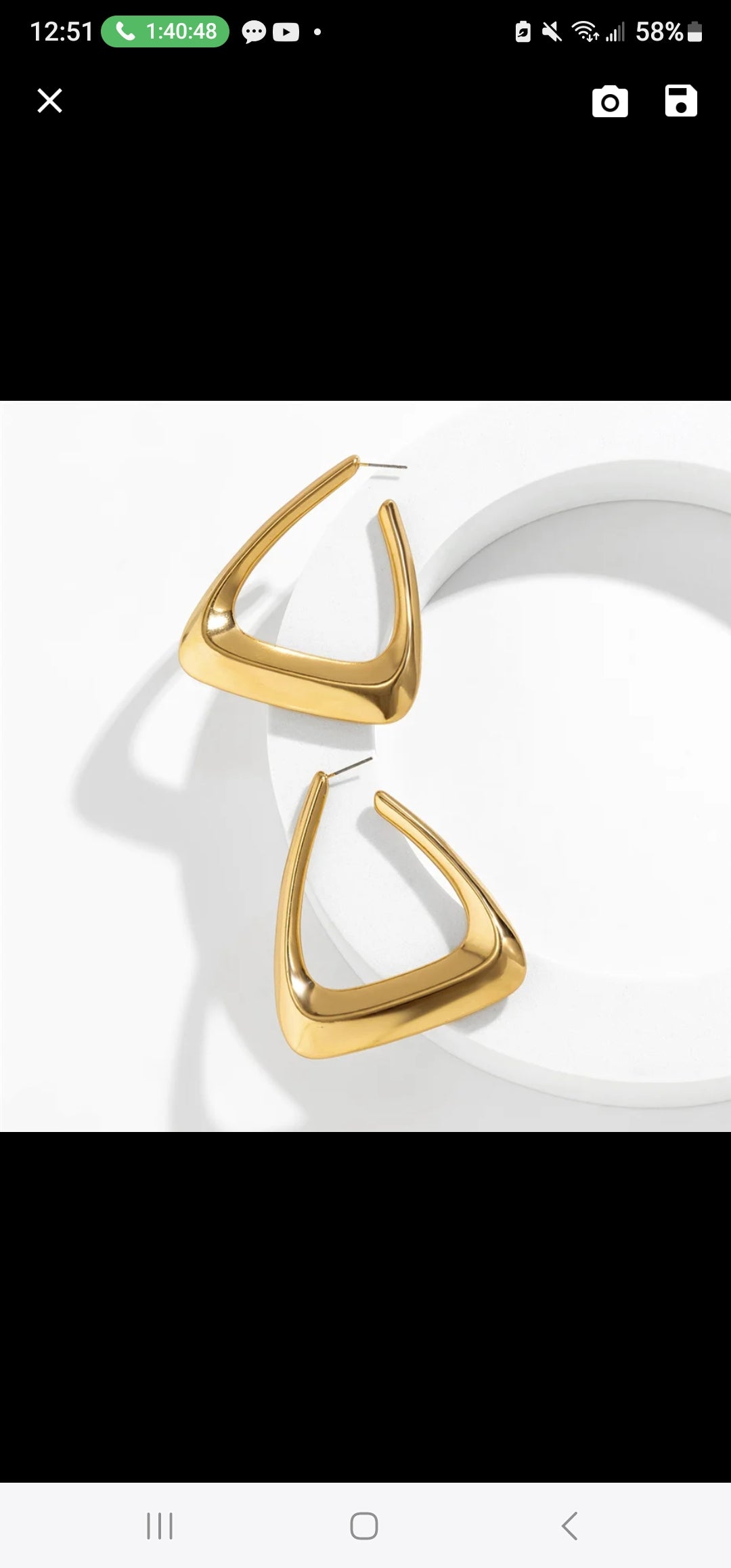 A pair of elegant triangular gold earrings showcasing a modern design, perfect for any occasion.