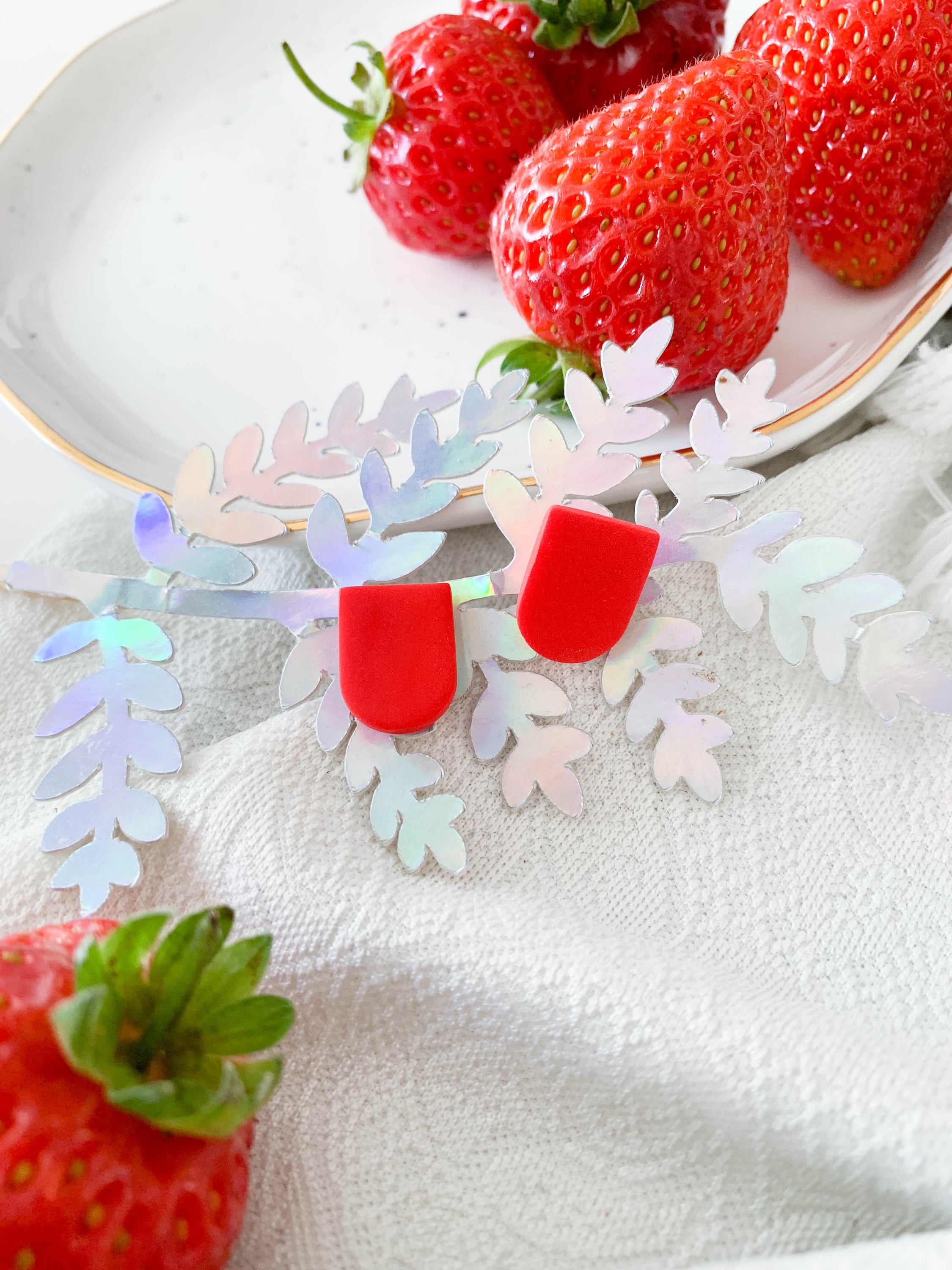 Ulma Strawberry earrings featuring a cute strawberry design with surgical steel posts for sensitive ears.