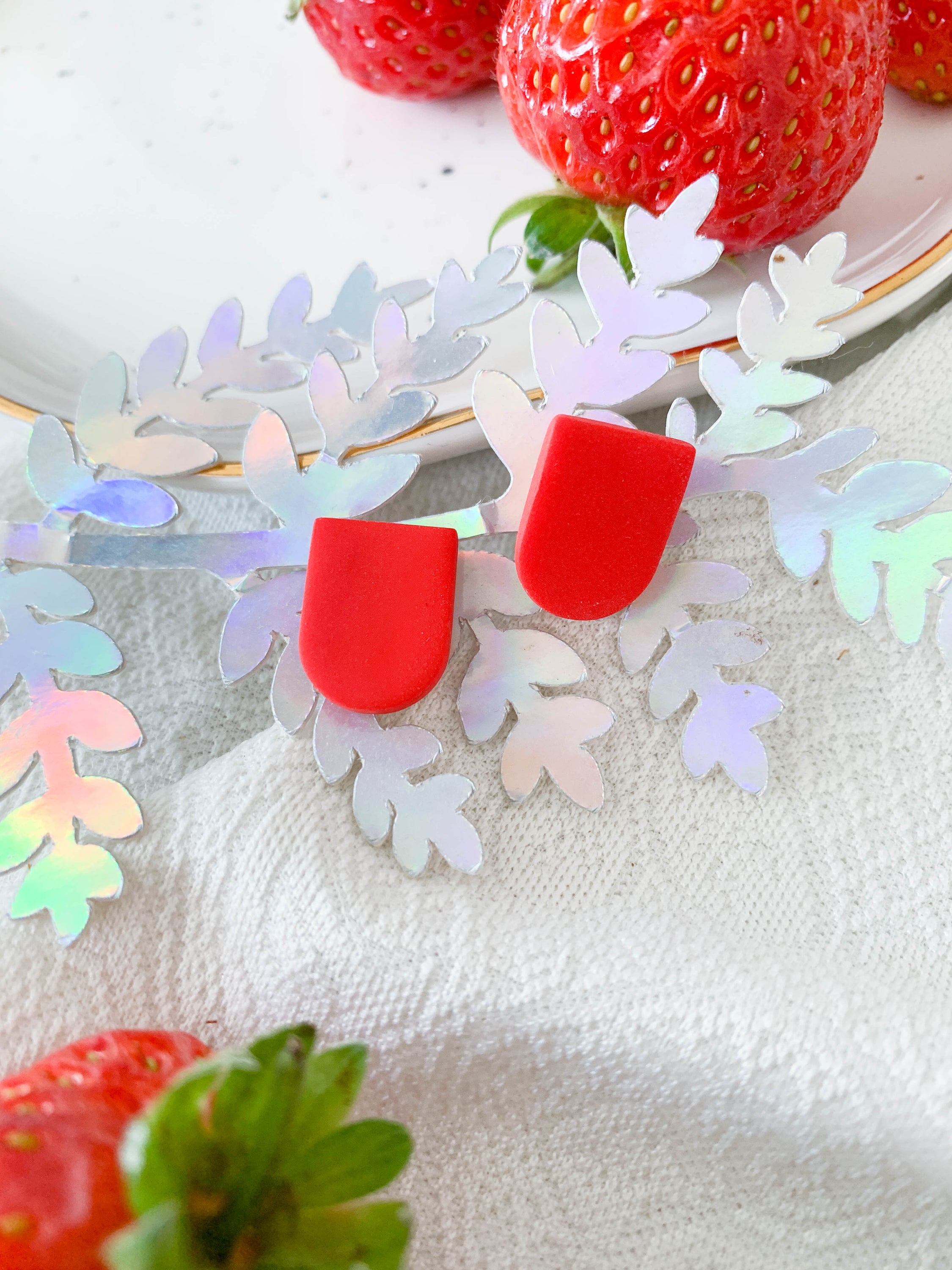 Ulma Strawberry earrings featuring a cute strawberry design with surgical steel posts for sensitive ears.