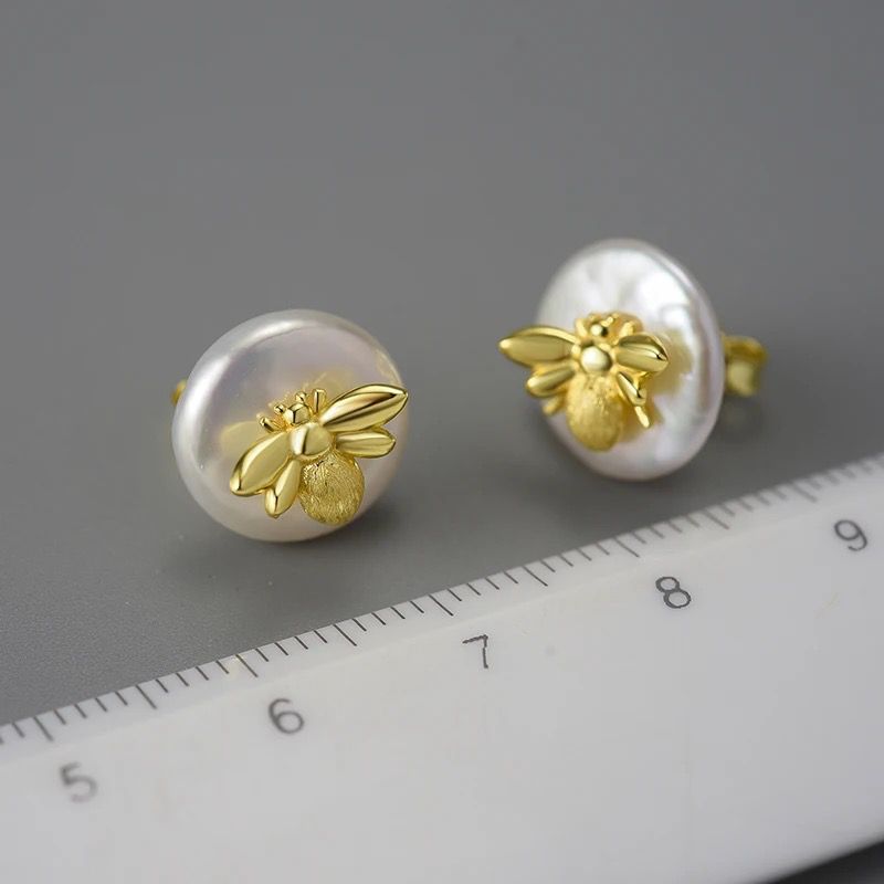 Vintage Bee Stud earrings in 18k gold with baroque pearls, showcasing intricate bee design and elegant luster.