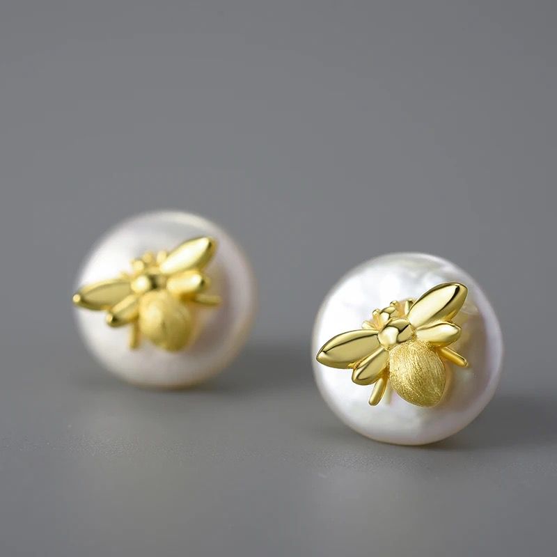 Vintage Bee Stud earrings in 18k gold with baroque pearls, showcasing intricate bee design and elegant luster.