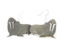 A pair of stylish Walrus Earrings #1097 made from sustainably sourced wood, featuring a unique gray color and hypoallergenic silver-finished ear wires.