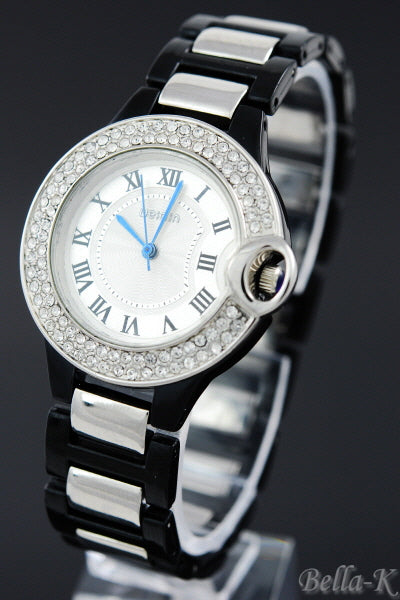 Elegant dual tone bracelet watch with stainless steel finish and fold over clasp.