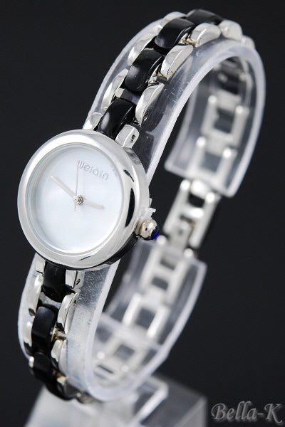 A stylish watch featuring a 1-inch case diameter and a 1/3-inch bracelet width, showcasing a secure hinge clasp.