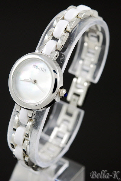 A stylish watch featuring a 1-inch case diameter and a 1/3-inch bracelet width, showcasing a secure hinge clasp.