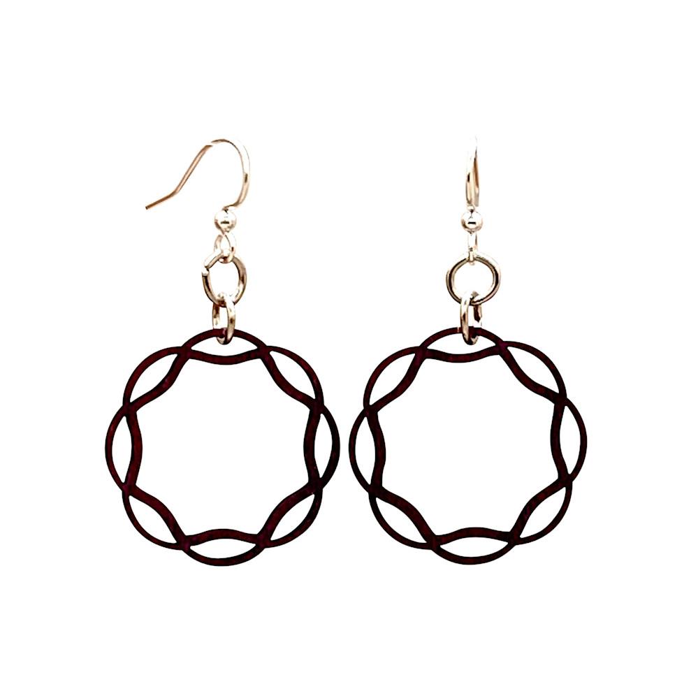 A pair of elegant Wavy Circle Earrings made from sustainably sourced wood, featuring silver-finished stainless steel ear wires, displayed against a neutral background.