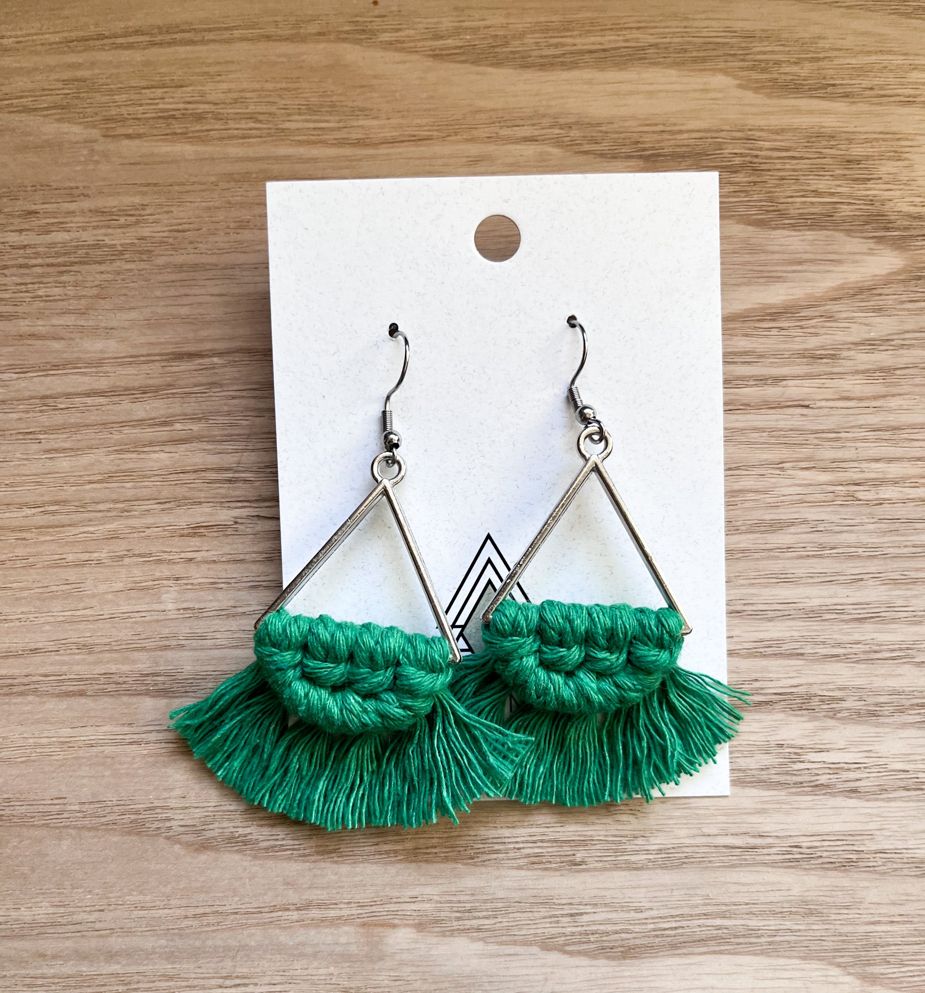 A pair of stylish Winter Green Triangles made from 100% cotton cord, showcasing their lightweight and eco-friendly design.