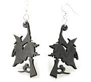 A pair of Witch On Broomstick Earrings made from laser-cut wood, featuring a whimsical design, stained in Black Satin color, with hypoallergenic stainless steel ear wires.