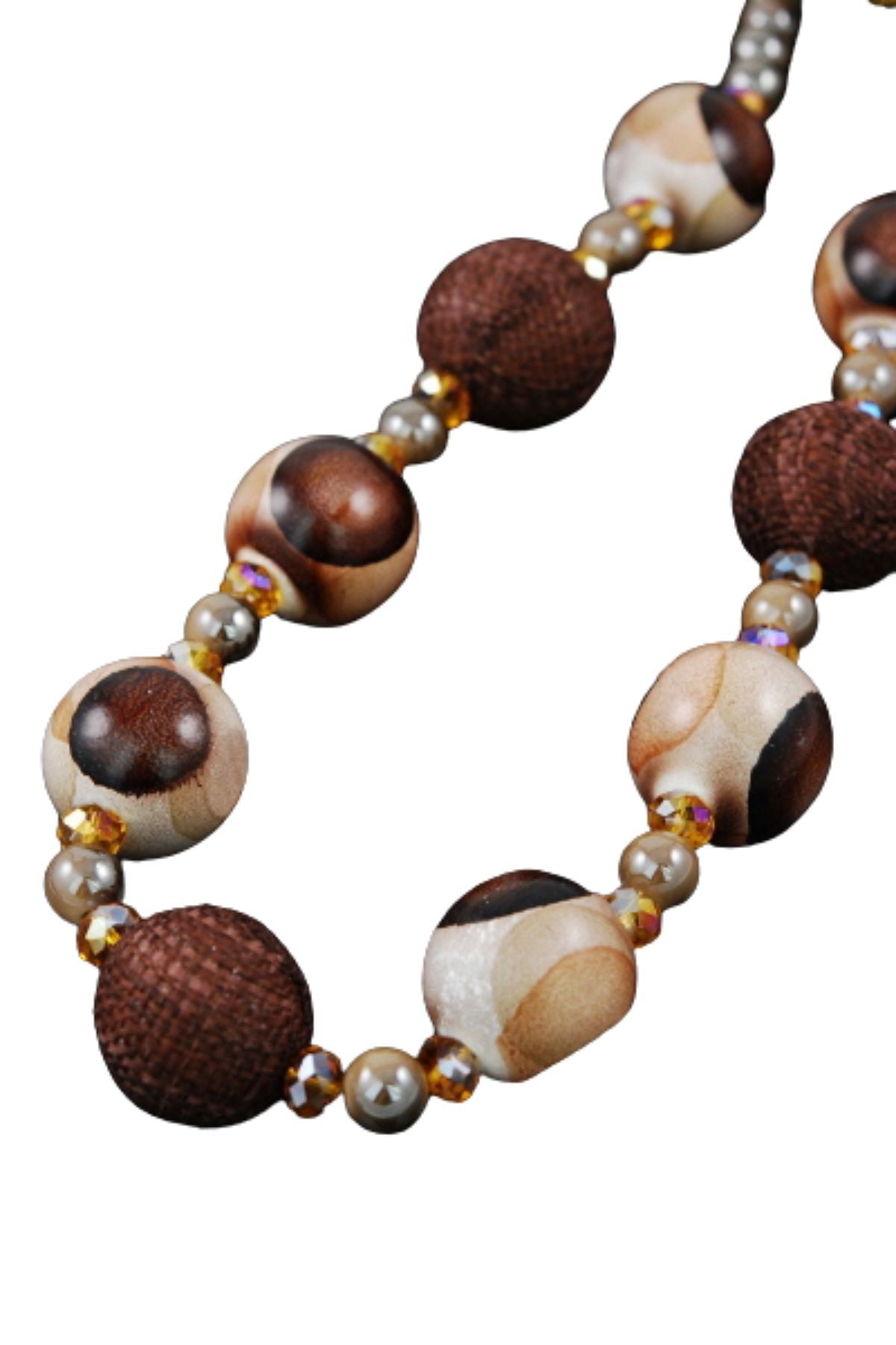 A stylish wooden ball bead necklace featuring a 20-inch chain and lobster claw clasp, showcasing natural wooden beads.