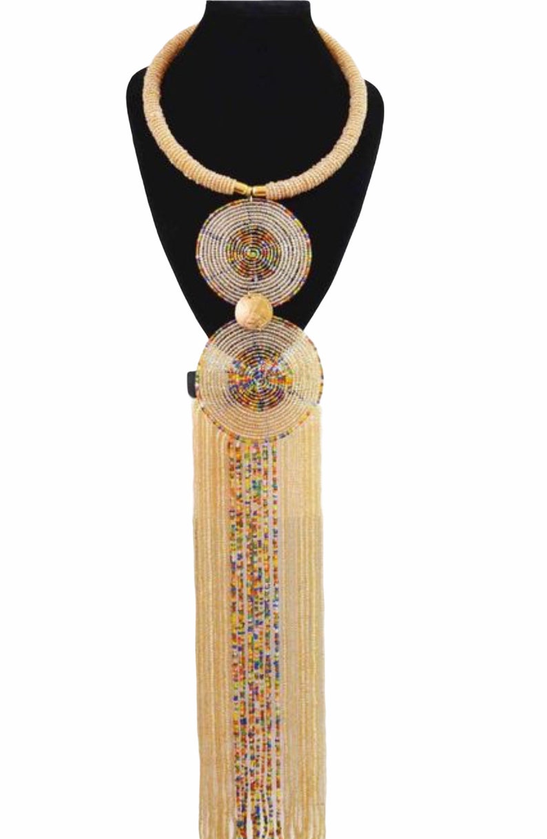 Handmade African pendant beaded necklace featuring vibrant colors and brass metal decoration, showcasing a long hanging fringe.