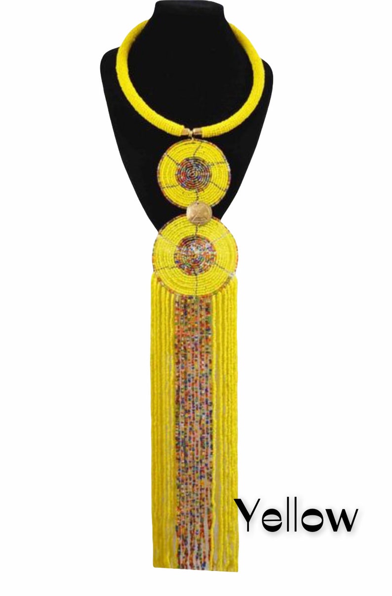 Handmade African pendant beaded necklace featuring vibrant colors and brass metal decoration, showcasing a long hanging fringe.