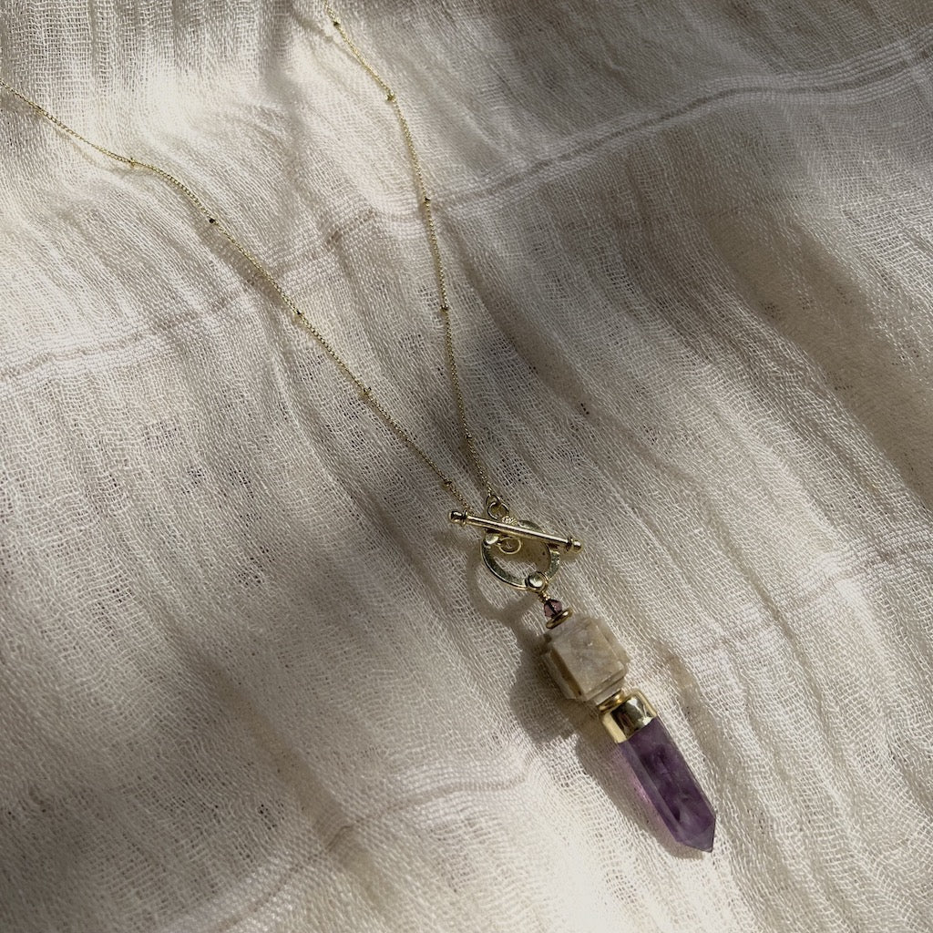 Amethyst Lariat Necklace featuring a polished amethyst pendant on a satellite chain with a bar and circle closure, handmade in India.