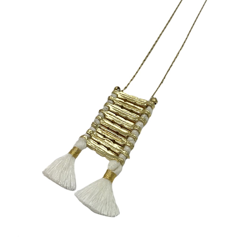 Anika Temple Necklace featuring zinc alloy metal and cotton tassels, showcasing intricate craftsmanship and a blend of traditional and modern design.