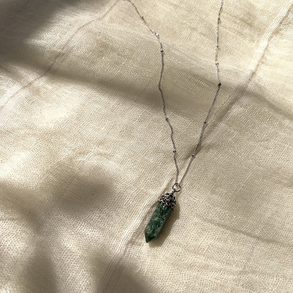 Aventurine crystal necklace with silver electroplated brass chain, showcasing its polished green stone and unique design.