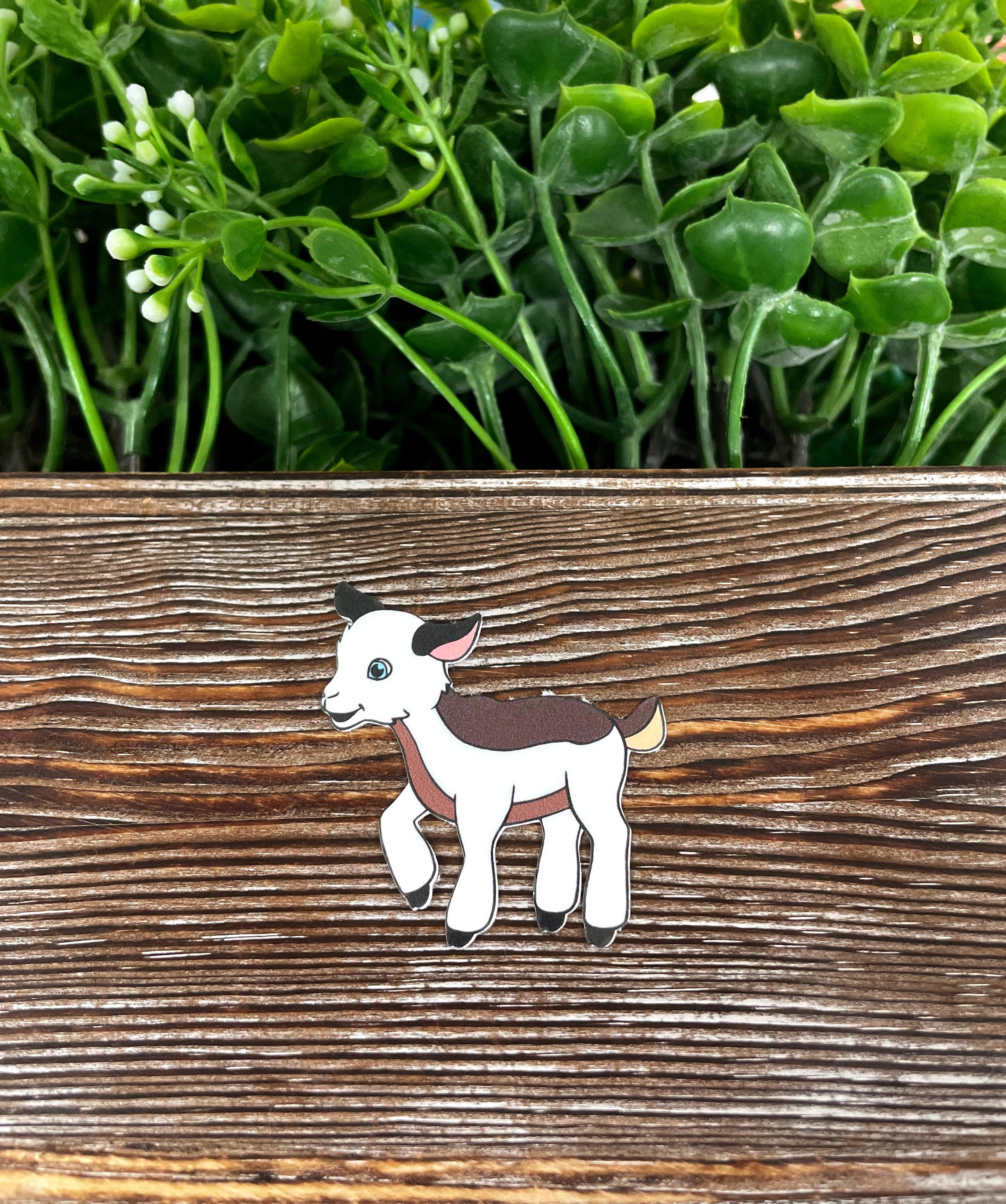 A vibrant Baby Goat Kid die cut vinyl sticker featuring a playful goat design, perfect for personalizing various smooth surfaces.