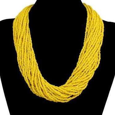 A vibrant yellow multi-layered beaded necklace handmade by Maasai artisans, showcasing unique craftsmanship and design.