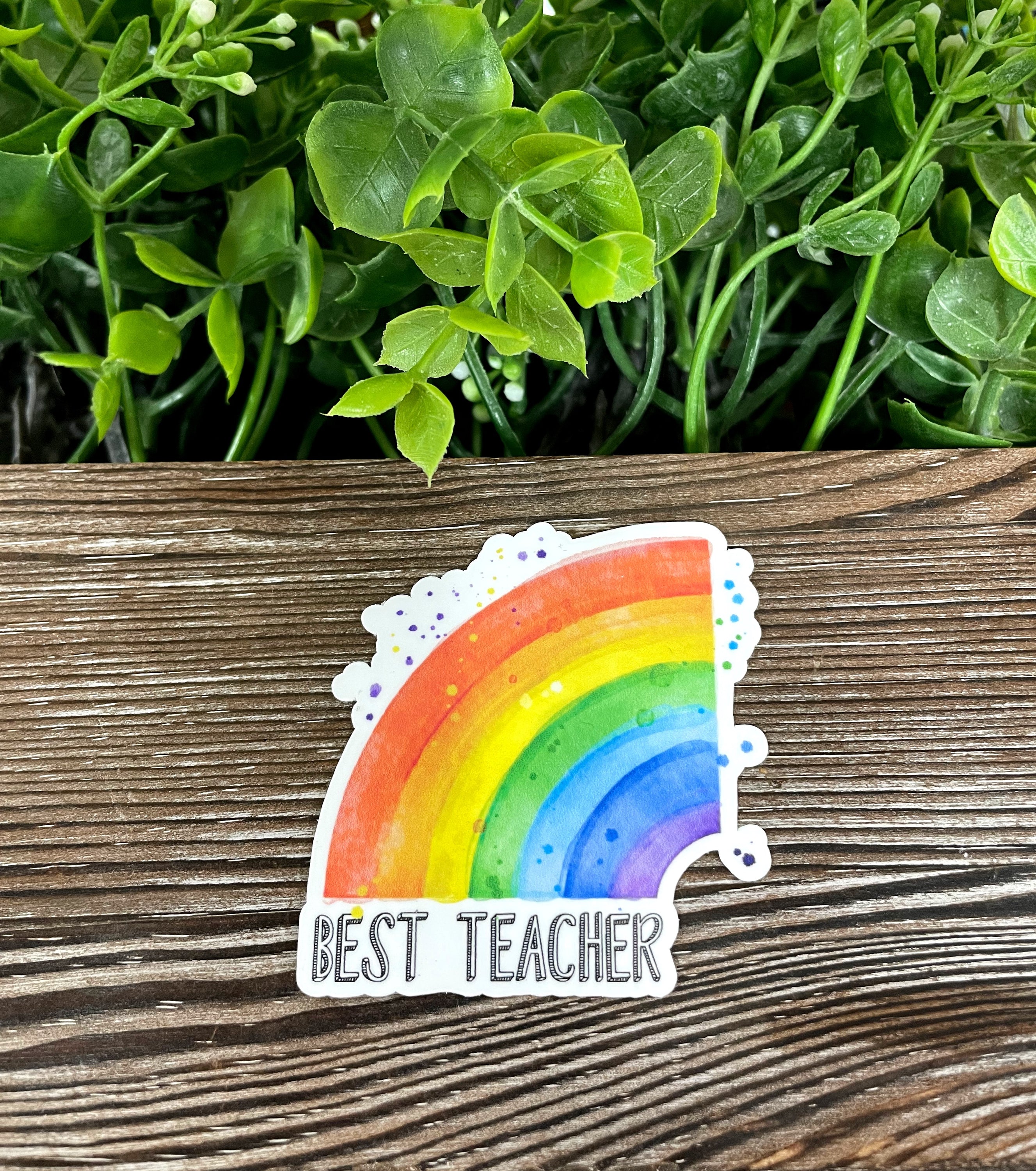 Colorful rainbow sticker with the text 'Best Teacher', perfect for personalizing items.