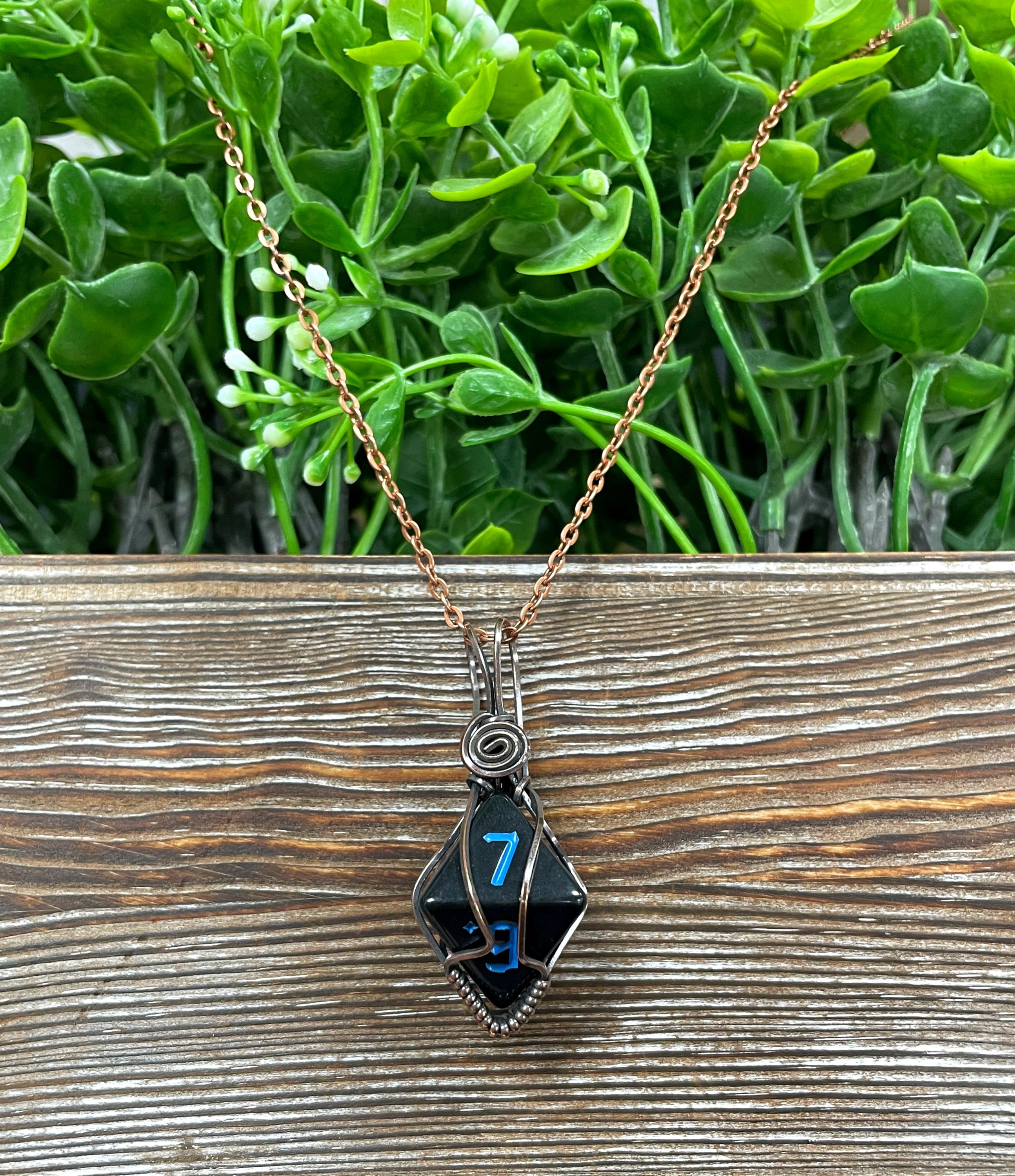 Black Wire Wrapped D8 Dice Pendant on a suede leather cord, showcasing oxidized copper wire wrapping and a vintage look.