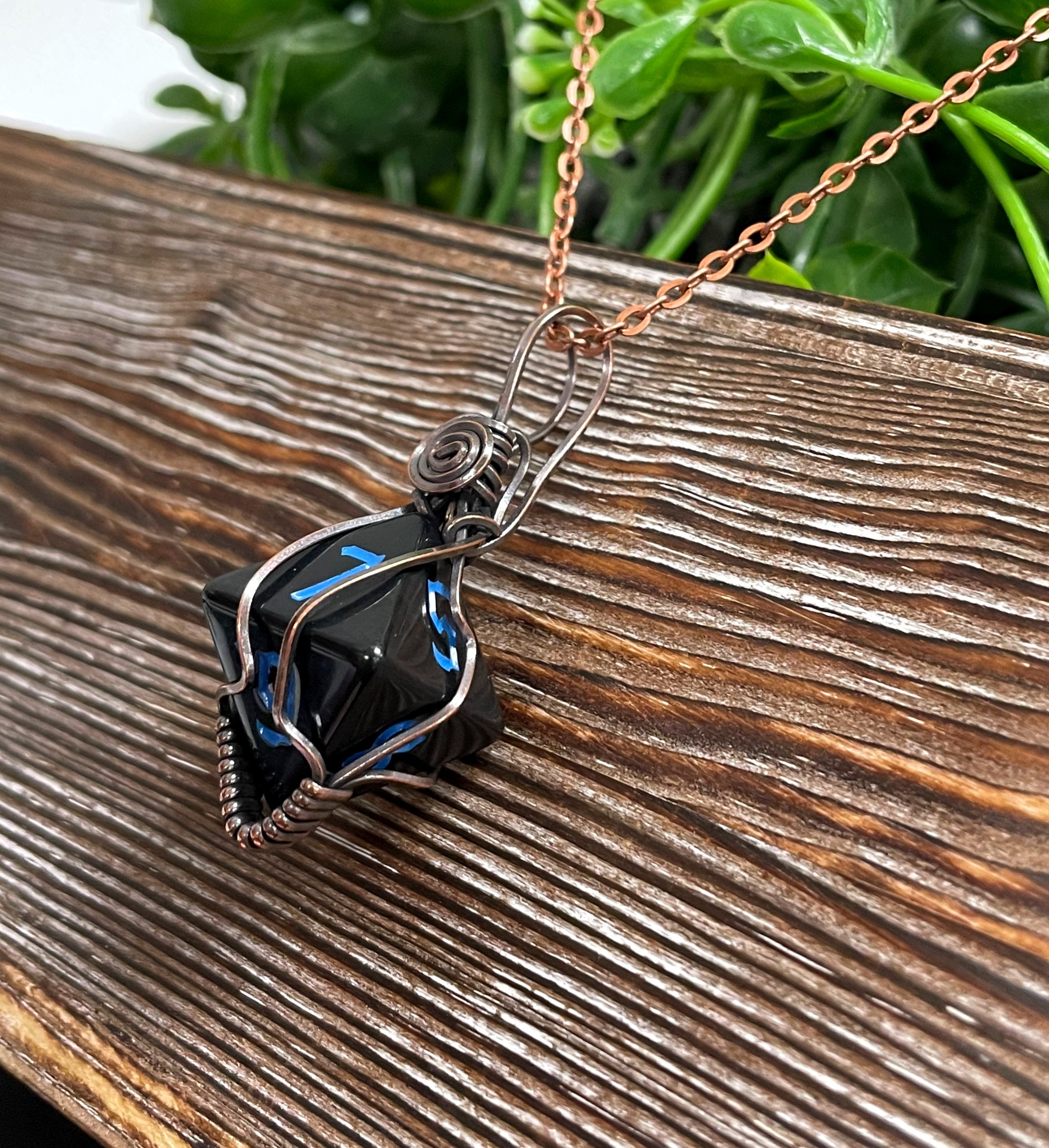 Black Wire Wrapped D8 Dice Pendant on a suede leather cord, showcasing oxidized copper wire wrapping and a vintage look.