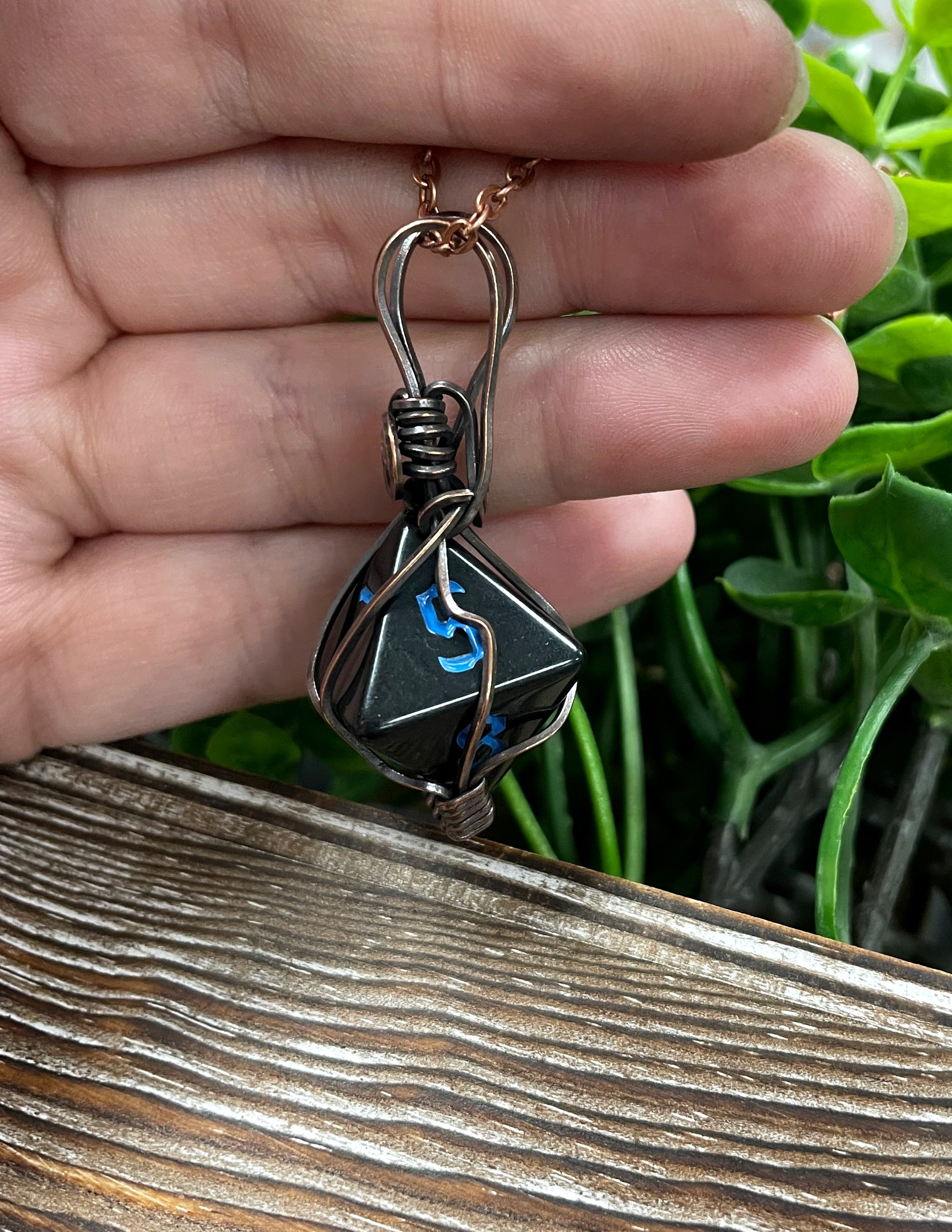 Black Wire Wrapped D8 Dice Pendant on a suede leather cord, showcasing oxidized copper wire wrapping and a vintage look.