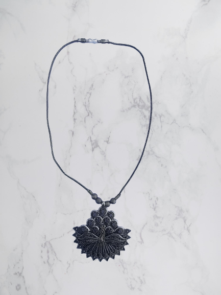 Bohotusk Elaborate Peacock Pendant Necklace featuring a detailed peacock design on a 54 cm chain made from oxidised German silver.