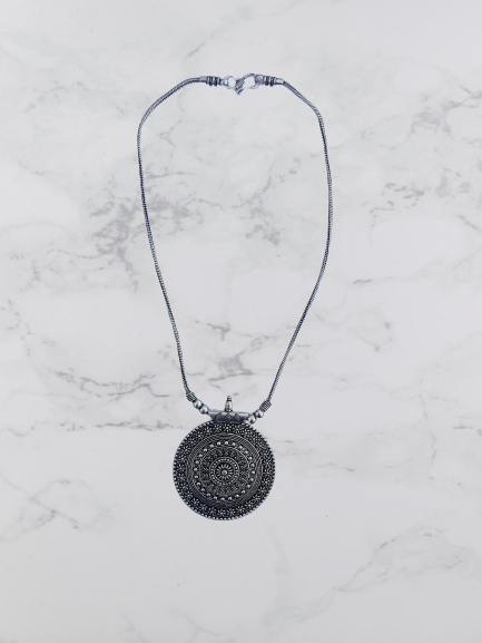 Bohotusk Large Round Silver Shield Pendant Necklace with a 54 cm chain, showcasing its elegant design and secure clasp.