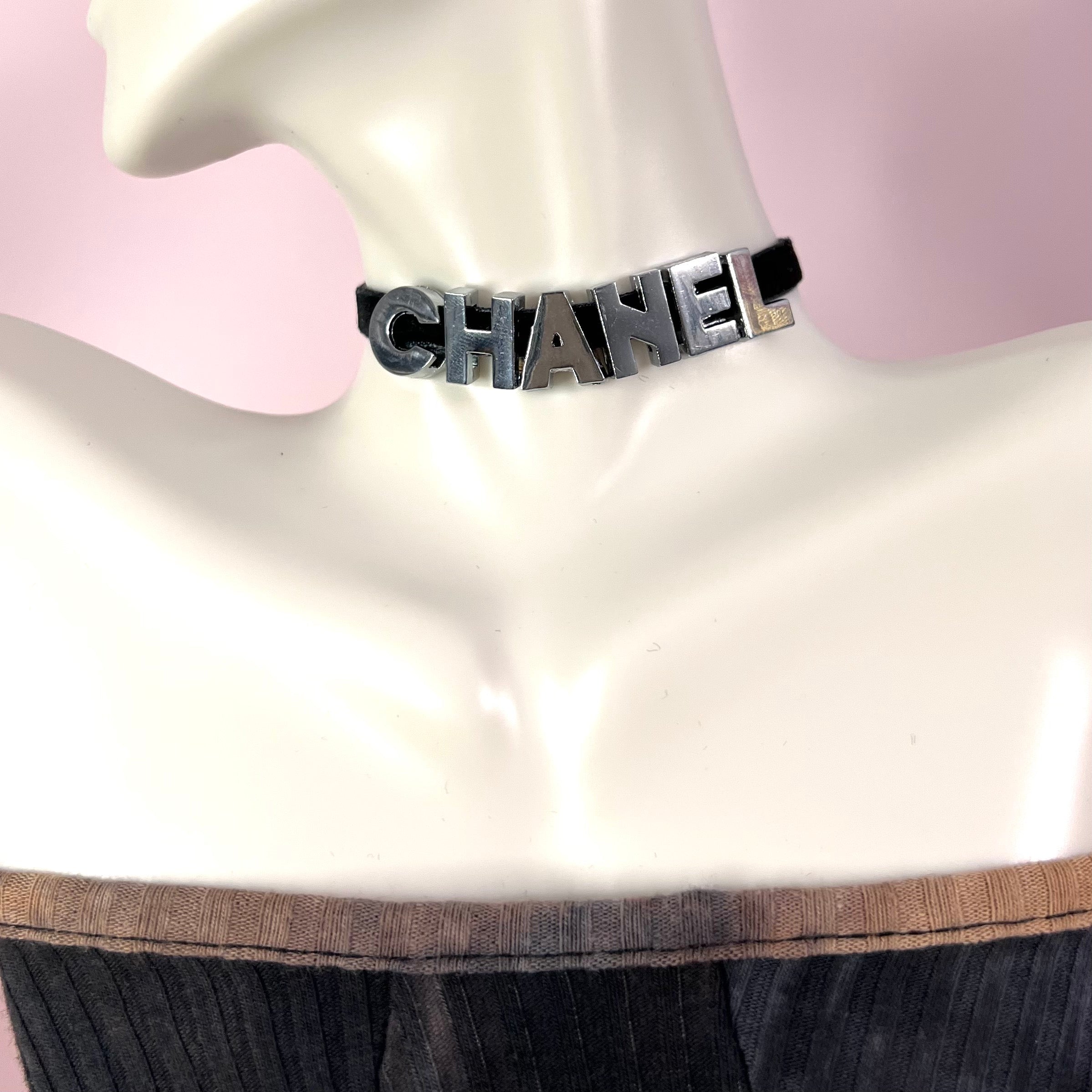 A stylish 'C' Choker Necklace featuring non-tarnish stainless steel letters on a soft velvet cord, available in gold and silver.