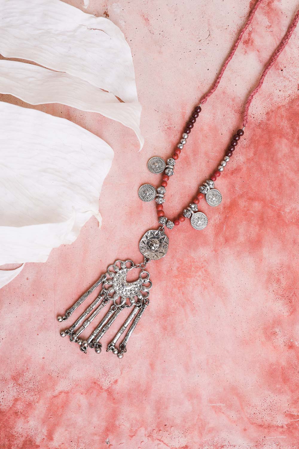 A stylish Charm Medallion with Back Lariat Necklace featuring intricate detailing and an adjustable lariat design, perfect for bohemian fashion.