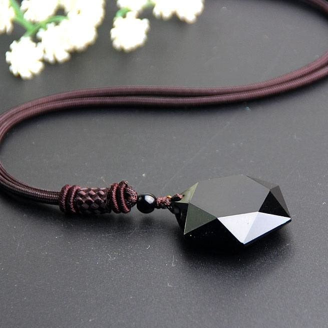 Collier 'Etoile' en Obsidienne Noire avec pendentif Merkaba, cordon ajustable, dimensions 2,6 x 3 x 0,9 cm.