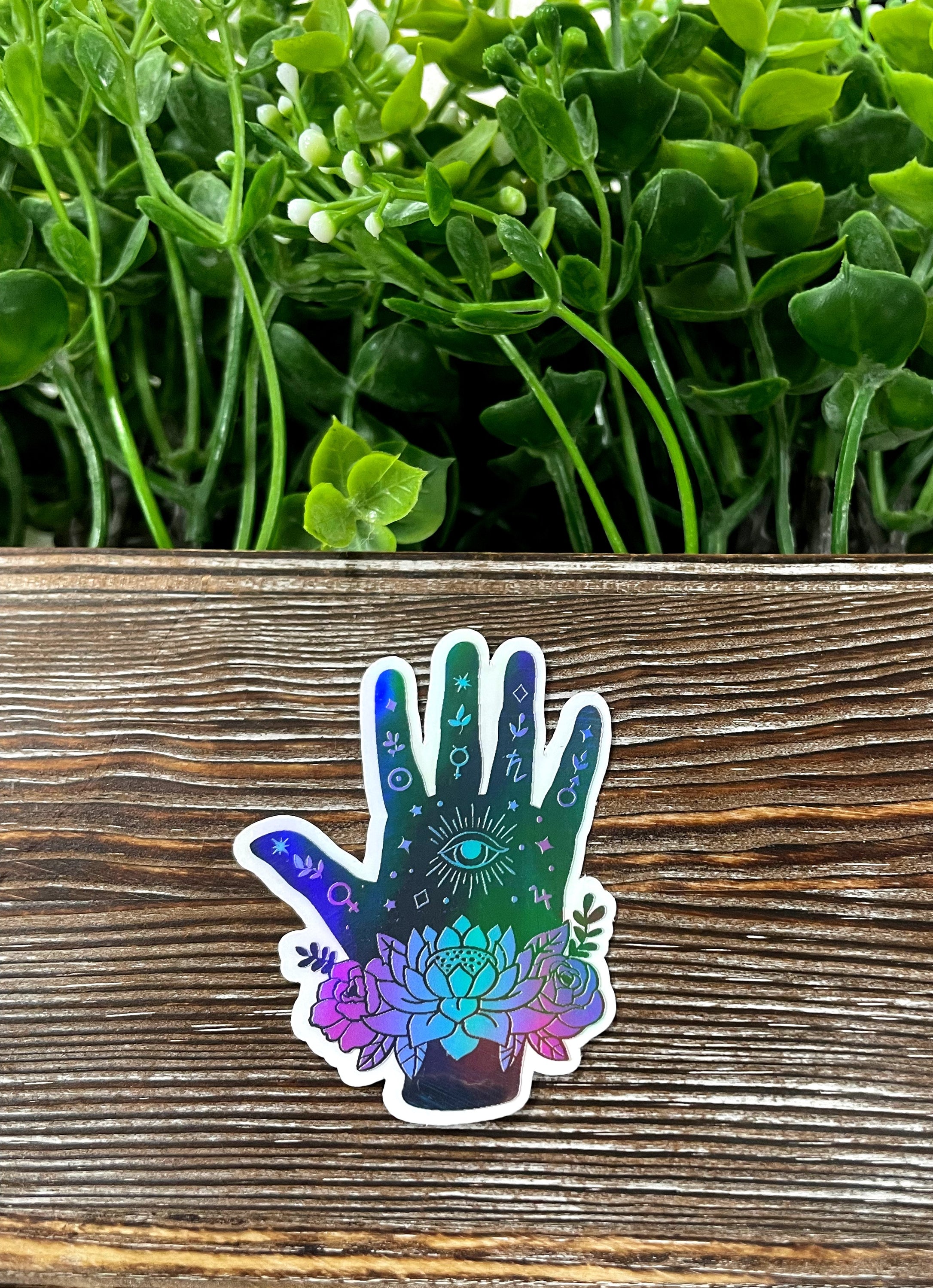 Cosmic Hand Palm die cut sticker featuring vibrant graphic art, perfect for personalizing smooth surfaces.